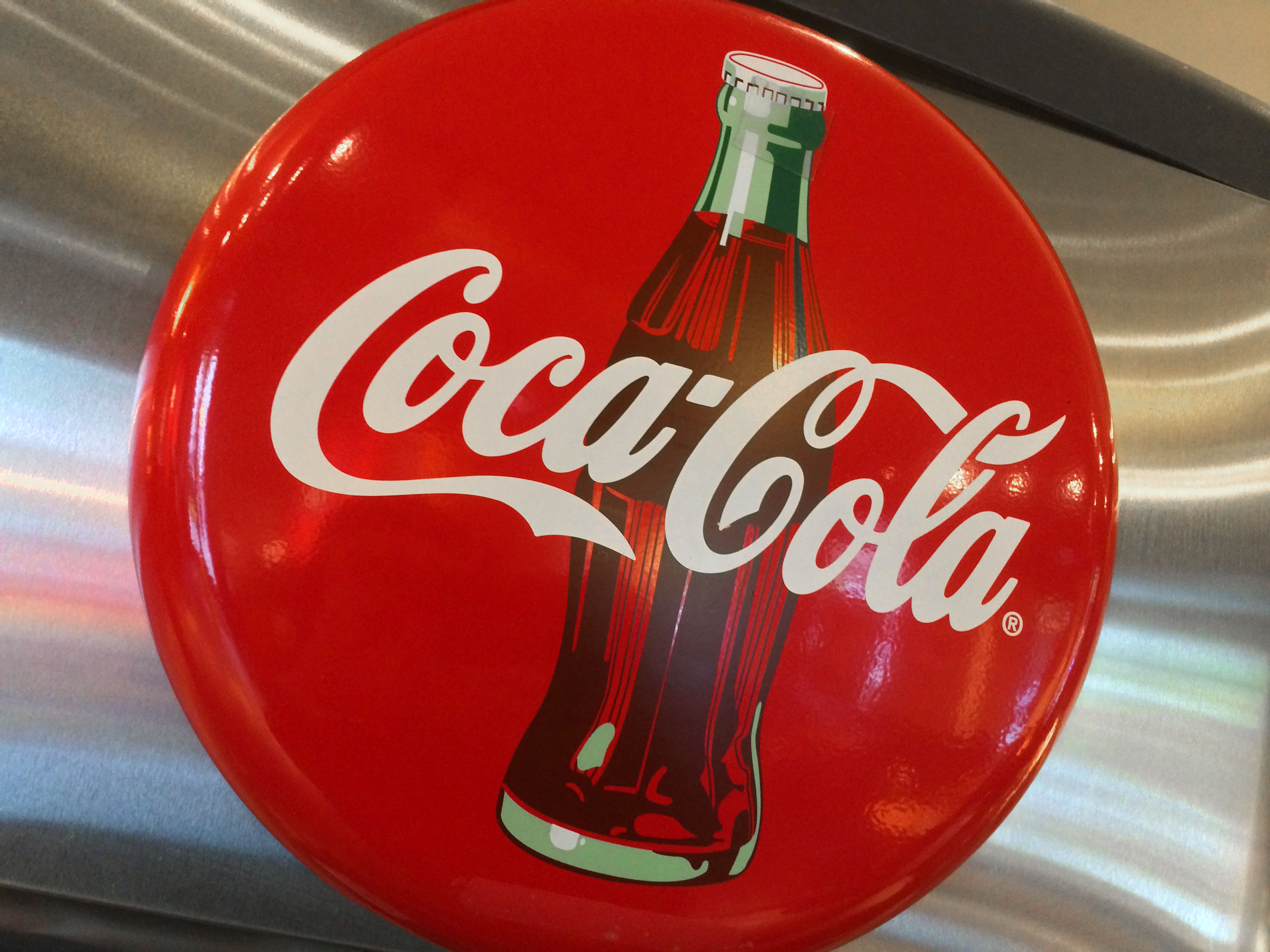 Coca-Cola puzzle in metal container - Northern Kentucky Auction, LLC