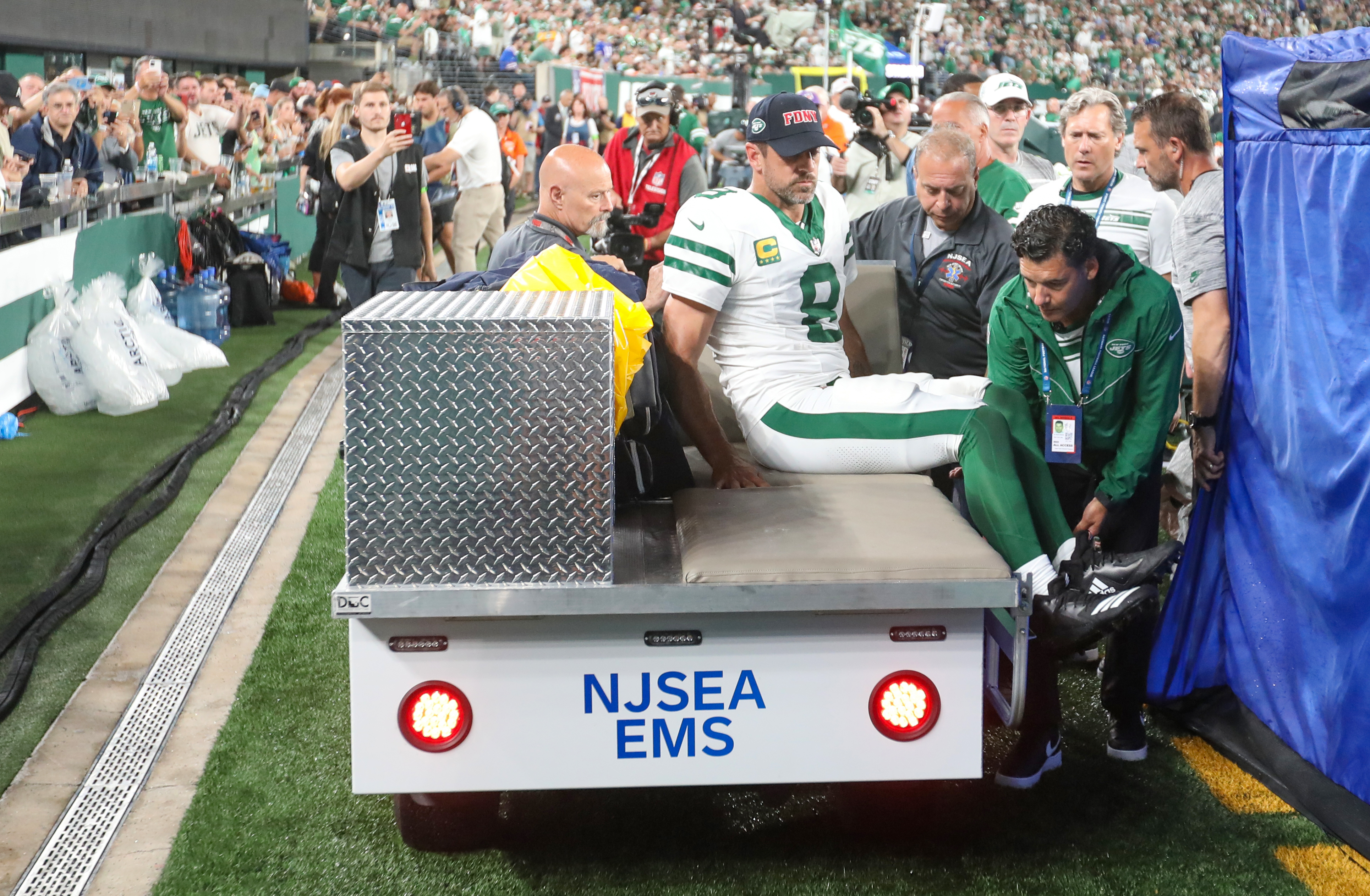 NY Jets' Aaron Rodgers carted off with ankle injury on first drive