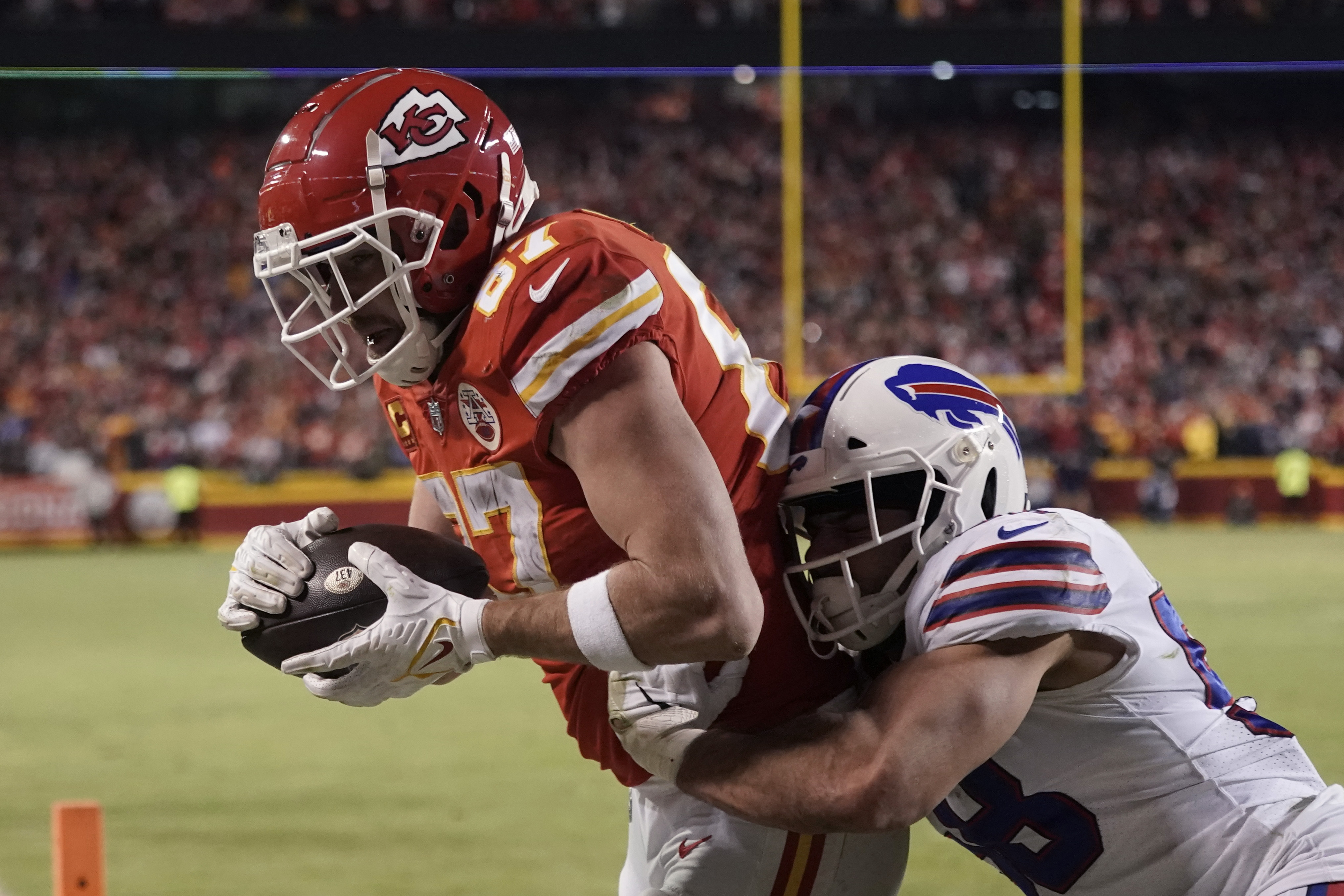 This pass to Buffalo Bills wide receiver Stefon Diggs (14) is broken up by  Kansas City Chiefs safety Juan Thornhill (22) and Kansas City Chiefs safety  L'Jarius Sneed (38) during the second