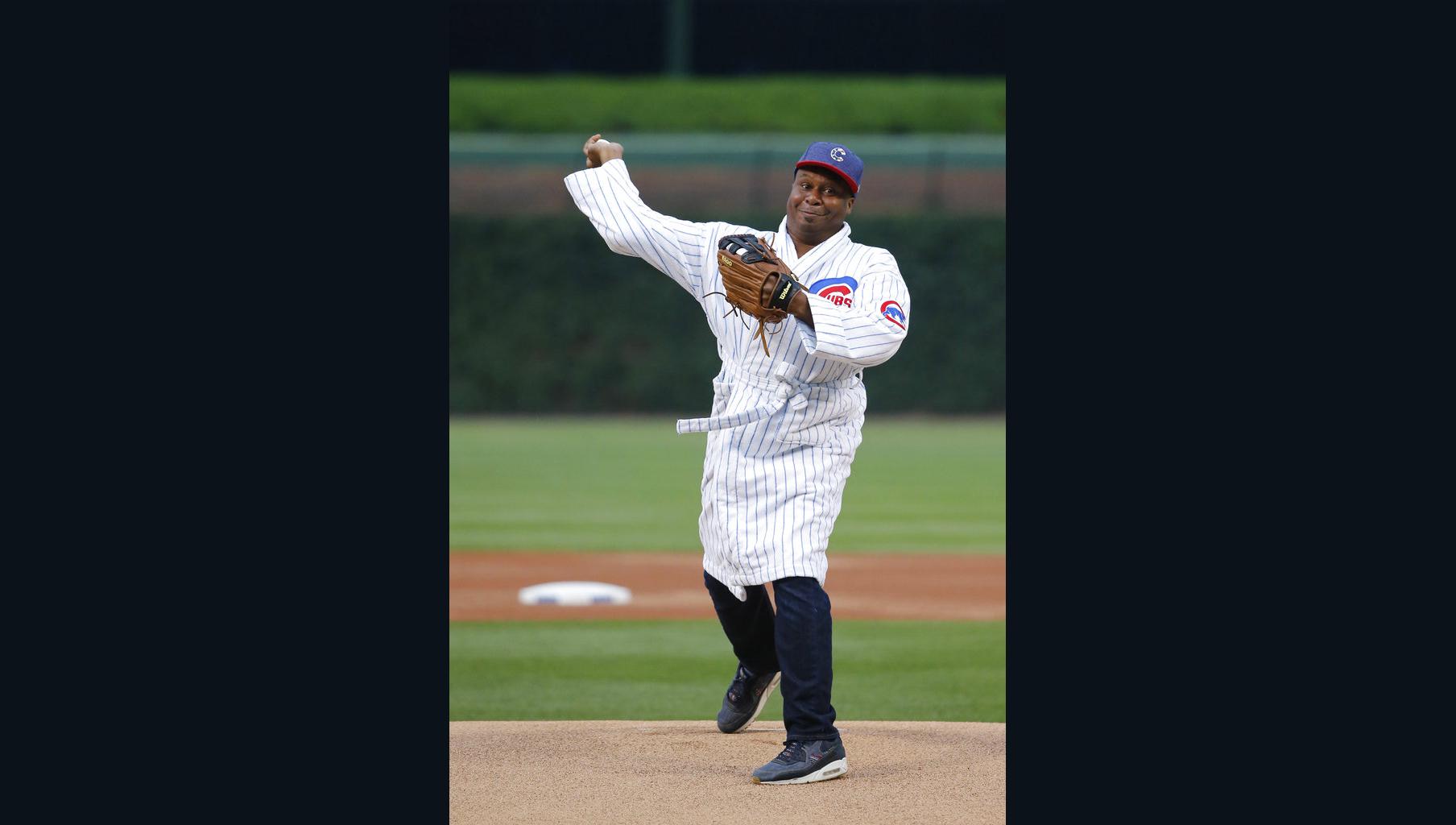 Former Chicago Cubs pitcher Kerry Wood's son Justin, 6, watches his  delivery while throwing out the ceremonial first pitch at Wrigley Field  before a baseball game between the St. Louis Cardinals and