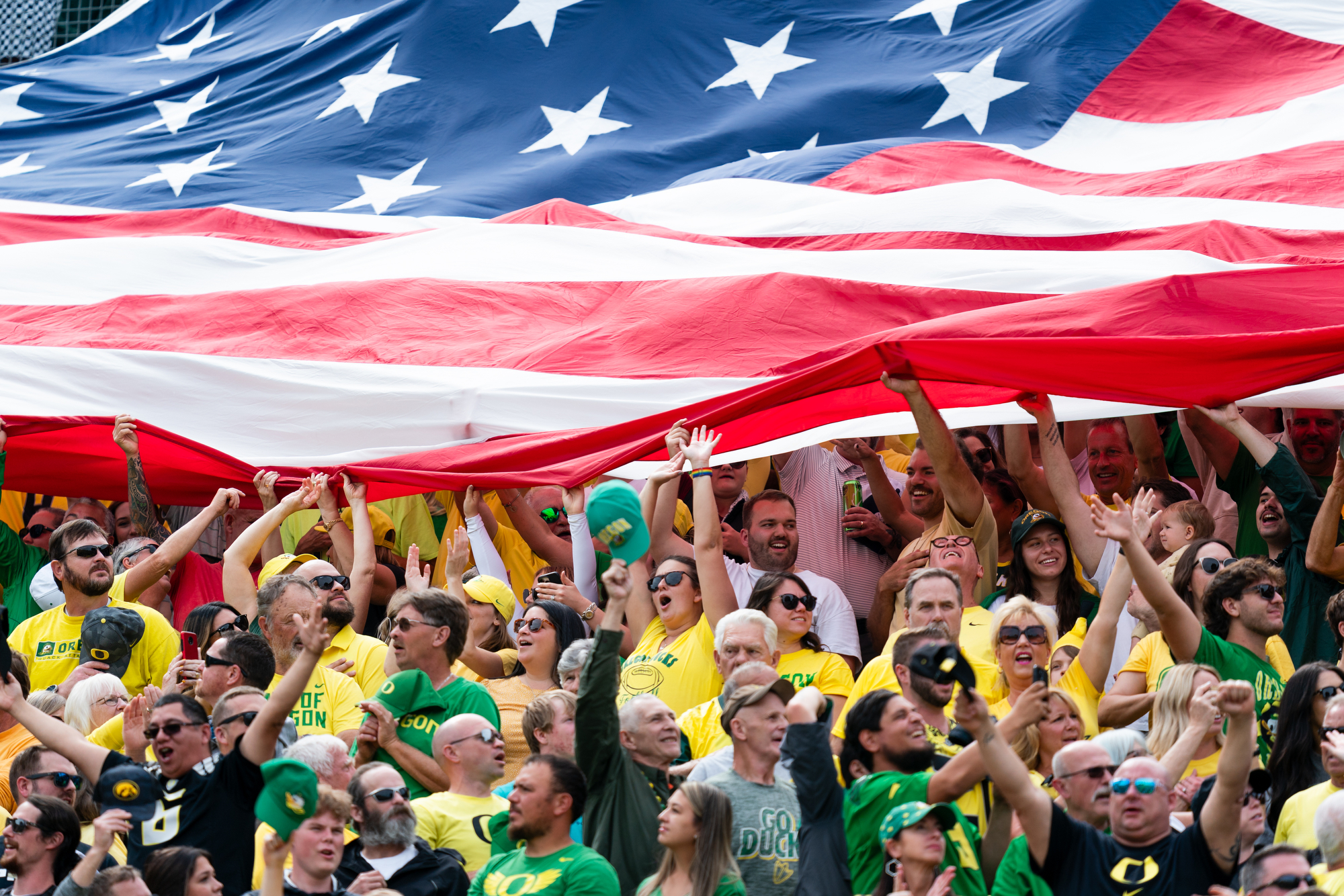 Fans wave the American flag before the game against the Colorado Buffaloes on Saturday, Sept. 23, 2023, at Autzen Stadium in Eugene.