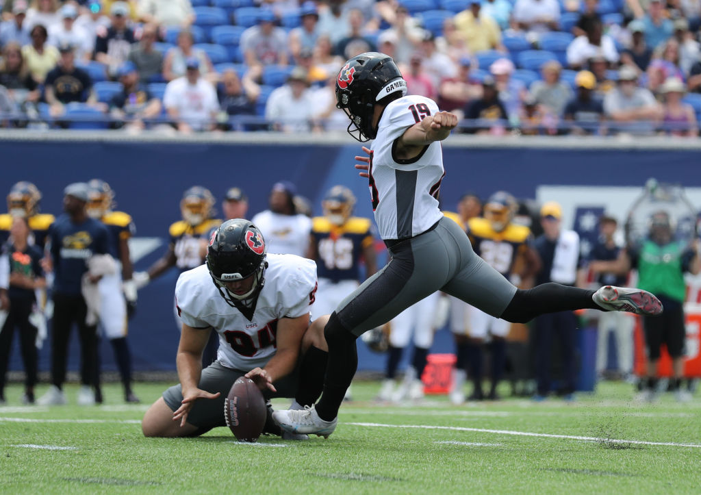 Braedon Bowman of New Jersey Generals gets tackled by Eli Walker of News  Photo - Getty Images