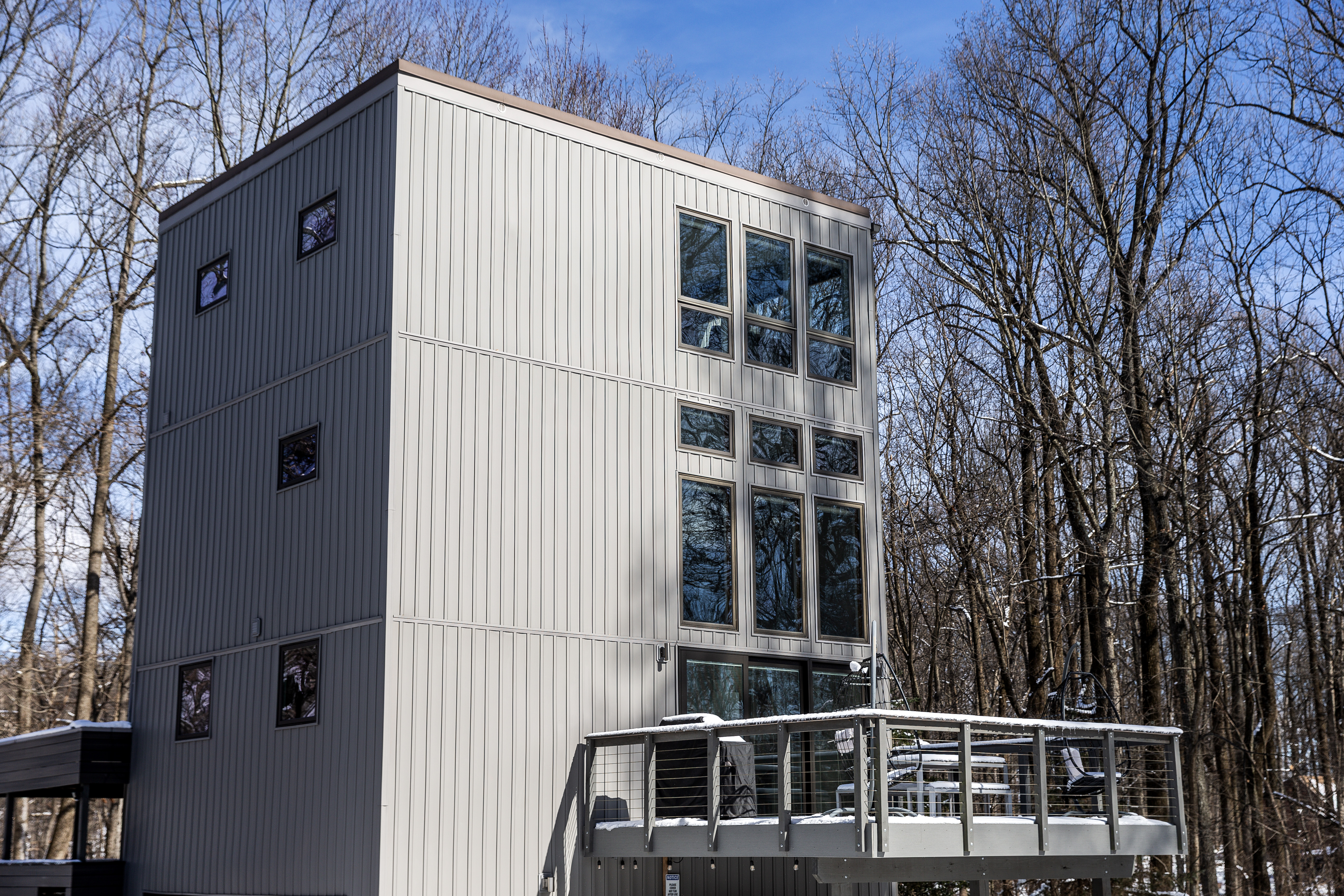 3-story modern 'cube' home is a peaceful retreat in the woods
