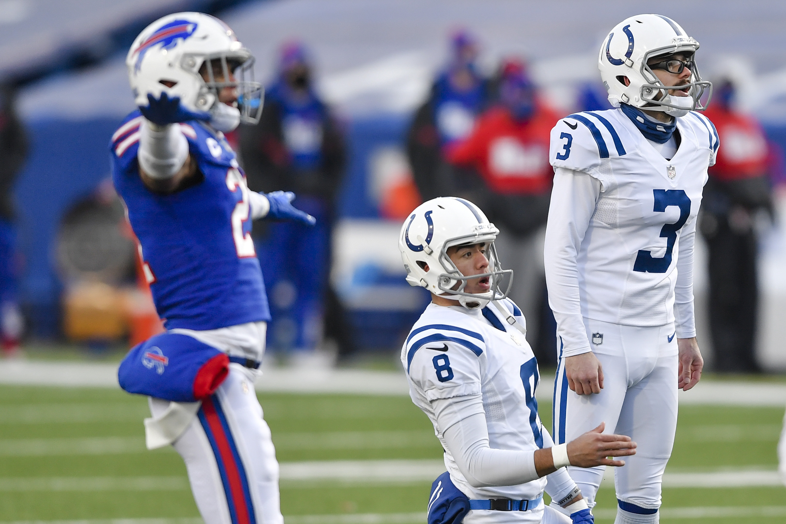 Buffalo Bills quarterback Josh Allen (17) and Indianapolis Colts  quarterback Philip Rivers (17) greet each other after the coin toss before  an NFL wild-card playoff football game, Saturday, Jan. 9, 2021, in