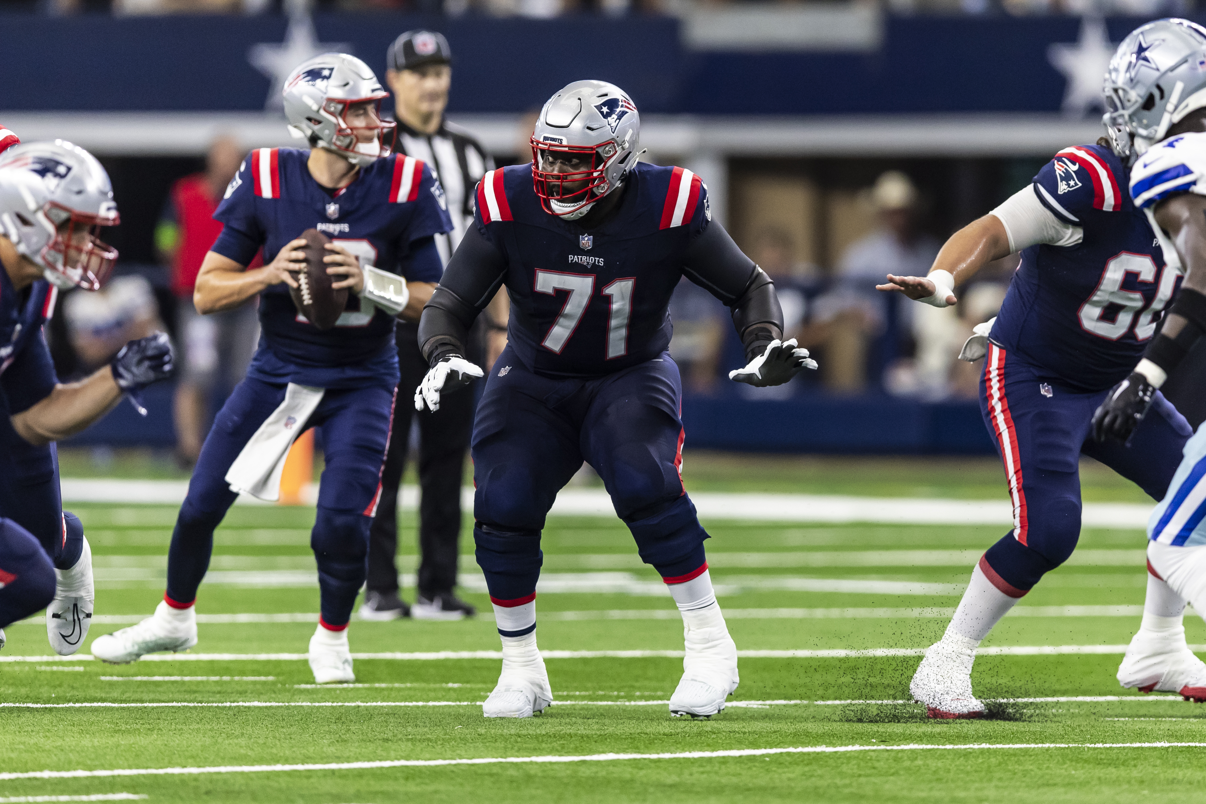 New England Patriots guard Mike Onwenu (71) blocks during an NFL