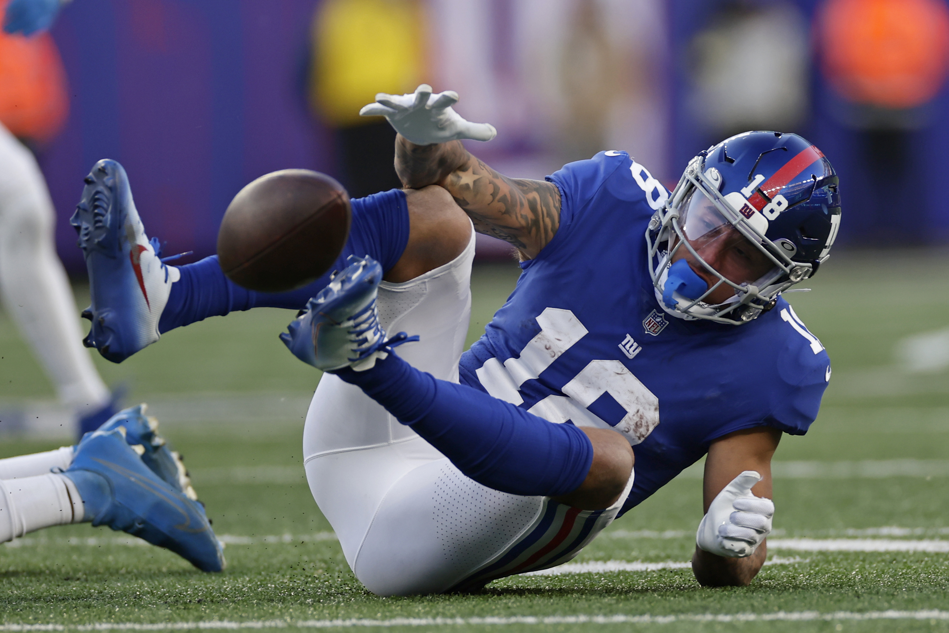 New York Giants wide receiver Isaiah Hodgins (18) runs with the