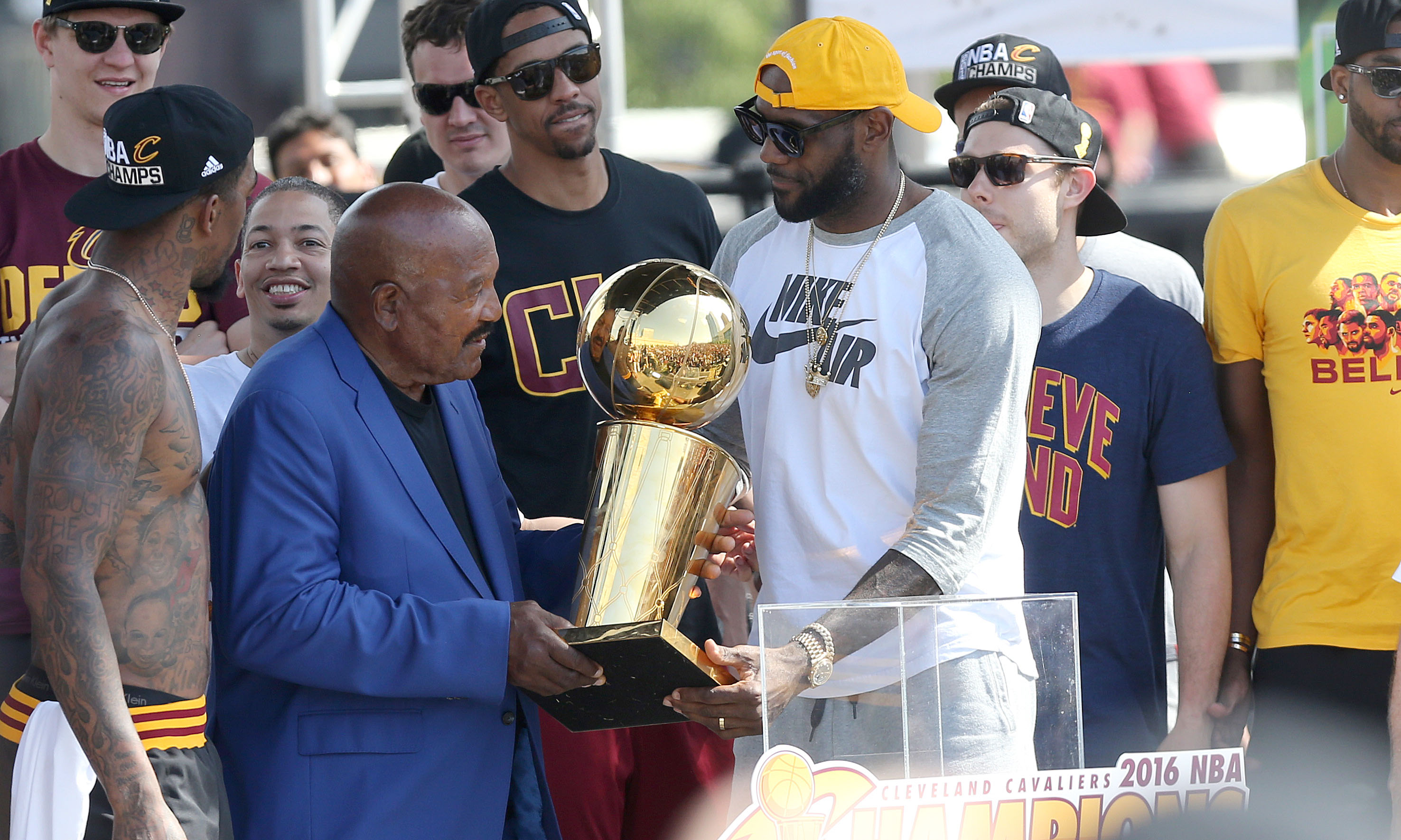 Cleveland Browns great Jim Brown hands the Larry O'Brien trophy to Cleveland Cavaliers forward LeBron James at a rally to celebrate and honor the 2016 NBA Champion Cleveland Cavaliers.    Joshua Gunter, cleveland.com June 22, 2016. Cleveland.