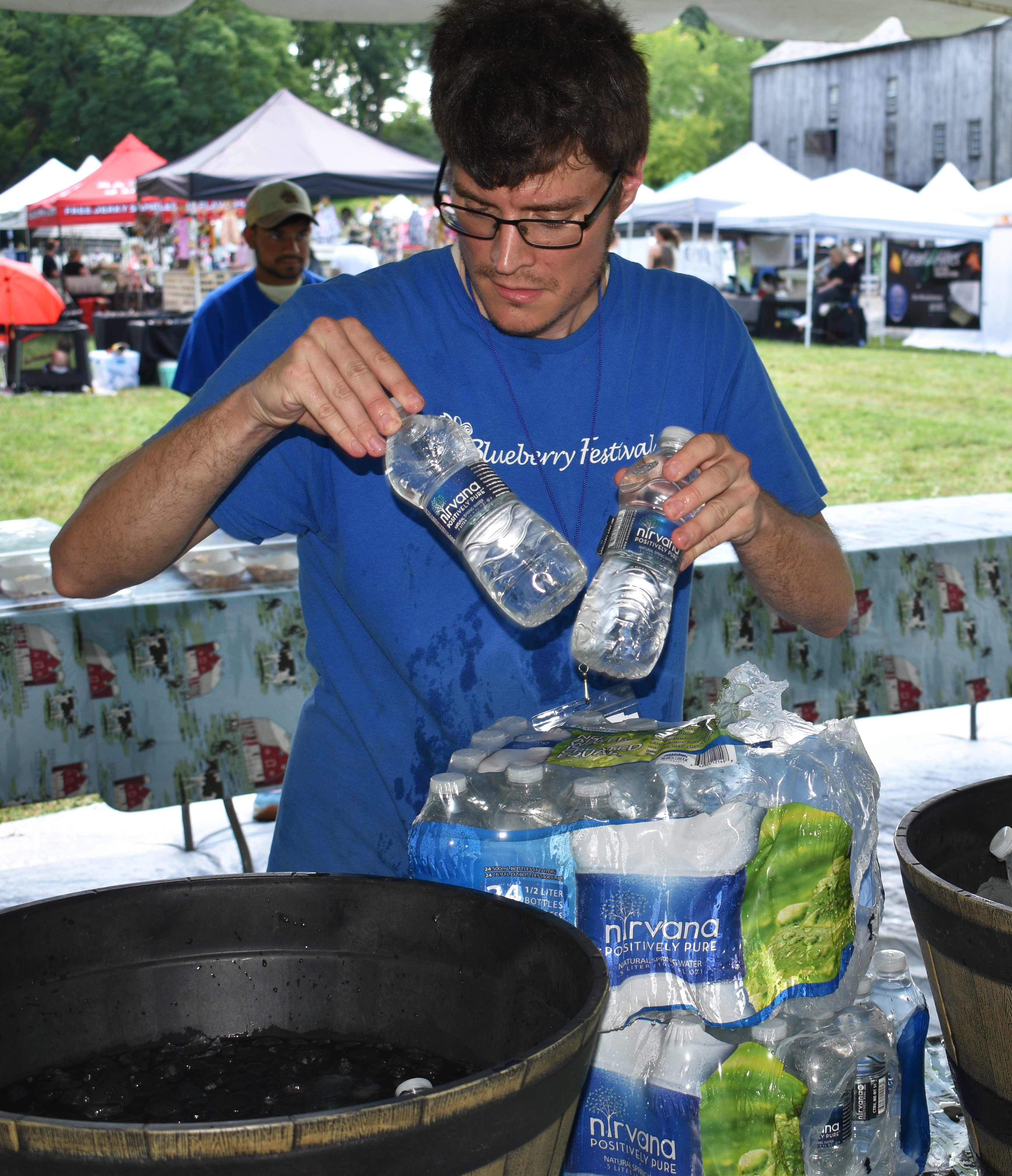Keith Sten, Historic Bethlehem Museums & Sites’ museum sites and education manager, ices drinks as the nonprofit hosts the first of two days of its Blueberry Festival & Market To Go on Saturday, July 13, 2024, at Burnside Plantation.