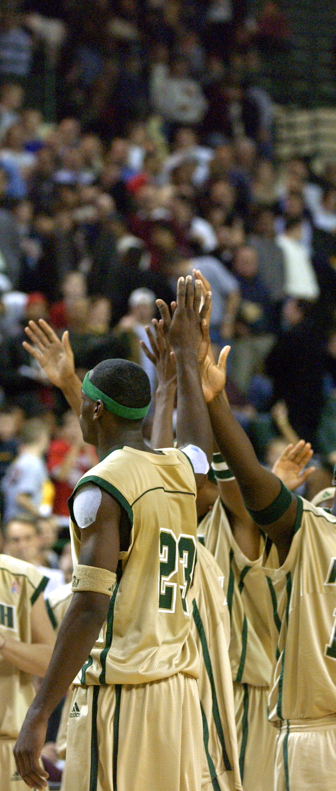 With just second left in the game and SVSM leading the game by 20, LeBron James receives a standing ovation from the crowd as he high-fives his teammates Thursday, December 12, 2002 at the Cleveland State Convocation Center in Cleveland. SVSM beat #1-ranked Oak Hill 65-45.  (Joshua Gunter/ The Plain Dealer) 
