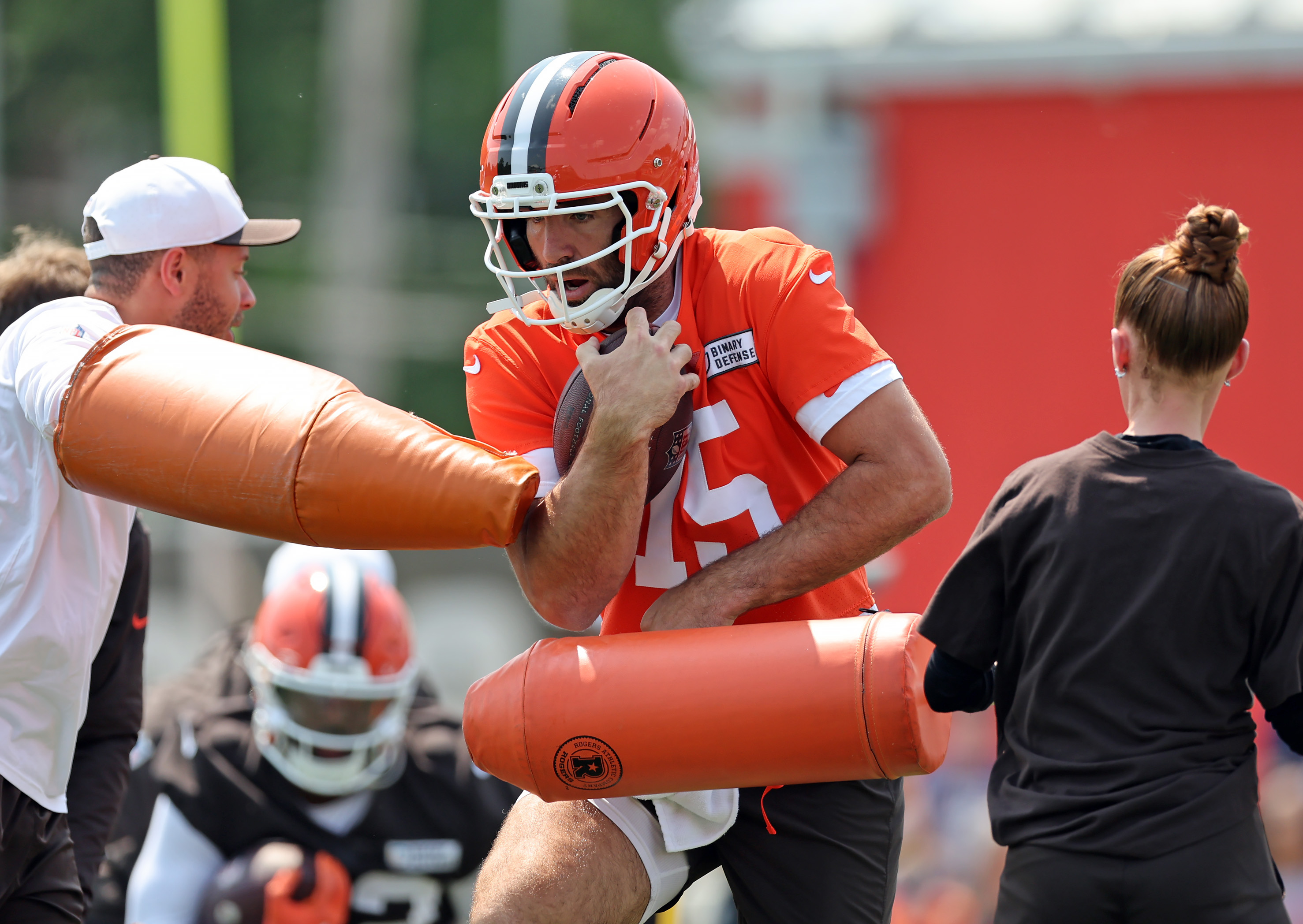 Cleveland Browns quarterback Joe Flacco runs a gauntlet during OTAs Wednesday in Berea. 