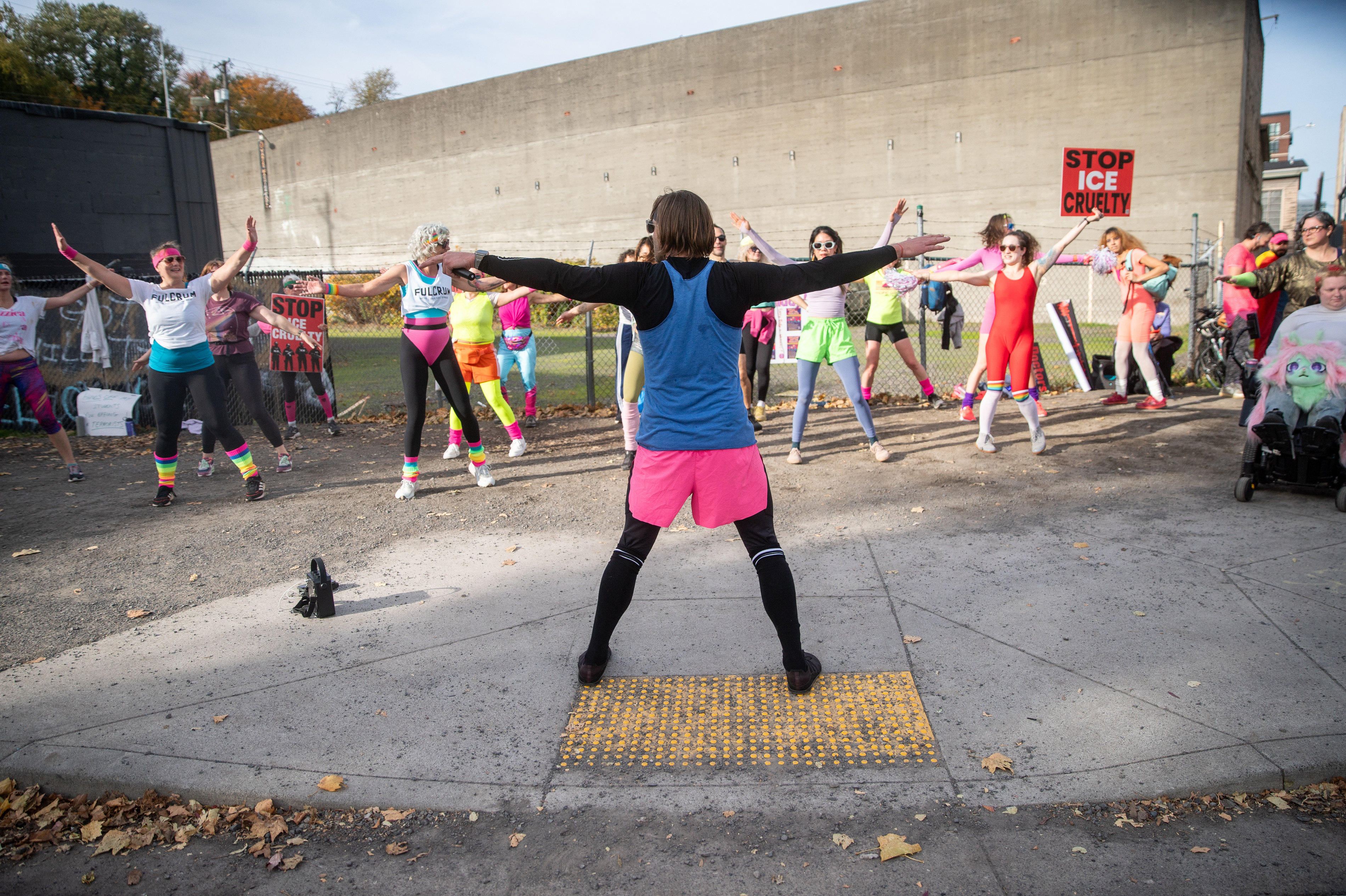 Participants in Fulcrum Fitness’s “Sweatin’ Out the Fascists” held an ’80s-aerobics peaceful protest outside the U.S. Immigration and Customs Enforcement (ICE) facility in South Portland on Sunday, Nov. 9, 2025, collecting donations for the Oregon Food Bank.