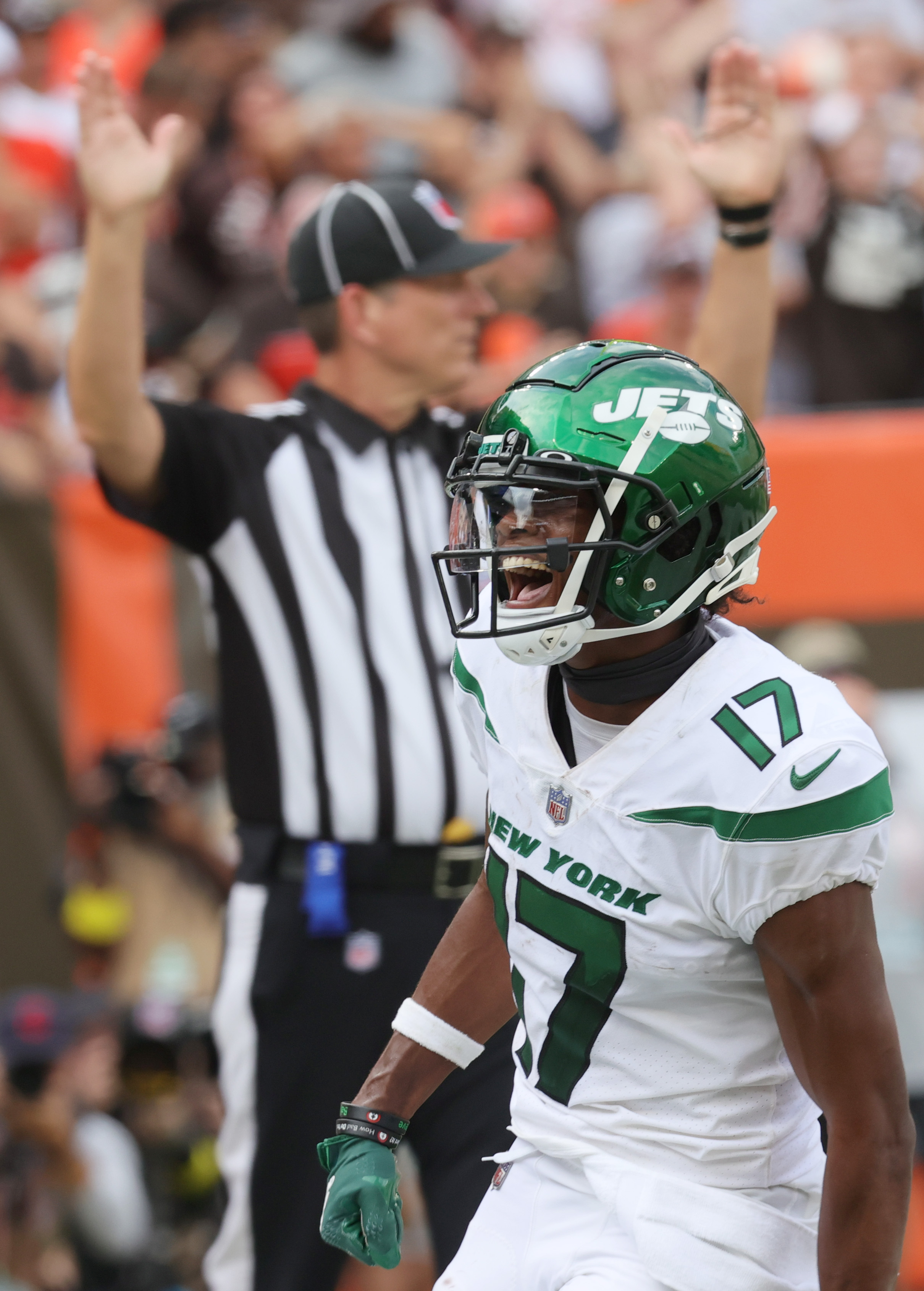 New York Jets wide receiver Garrett Wilson (17) runs after a catch against  Miami Dolphins cornerback Kader Kohou (28) during the first half of an NFL  football game on Sunday, Oct. 9