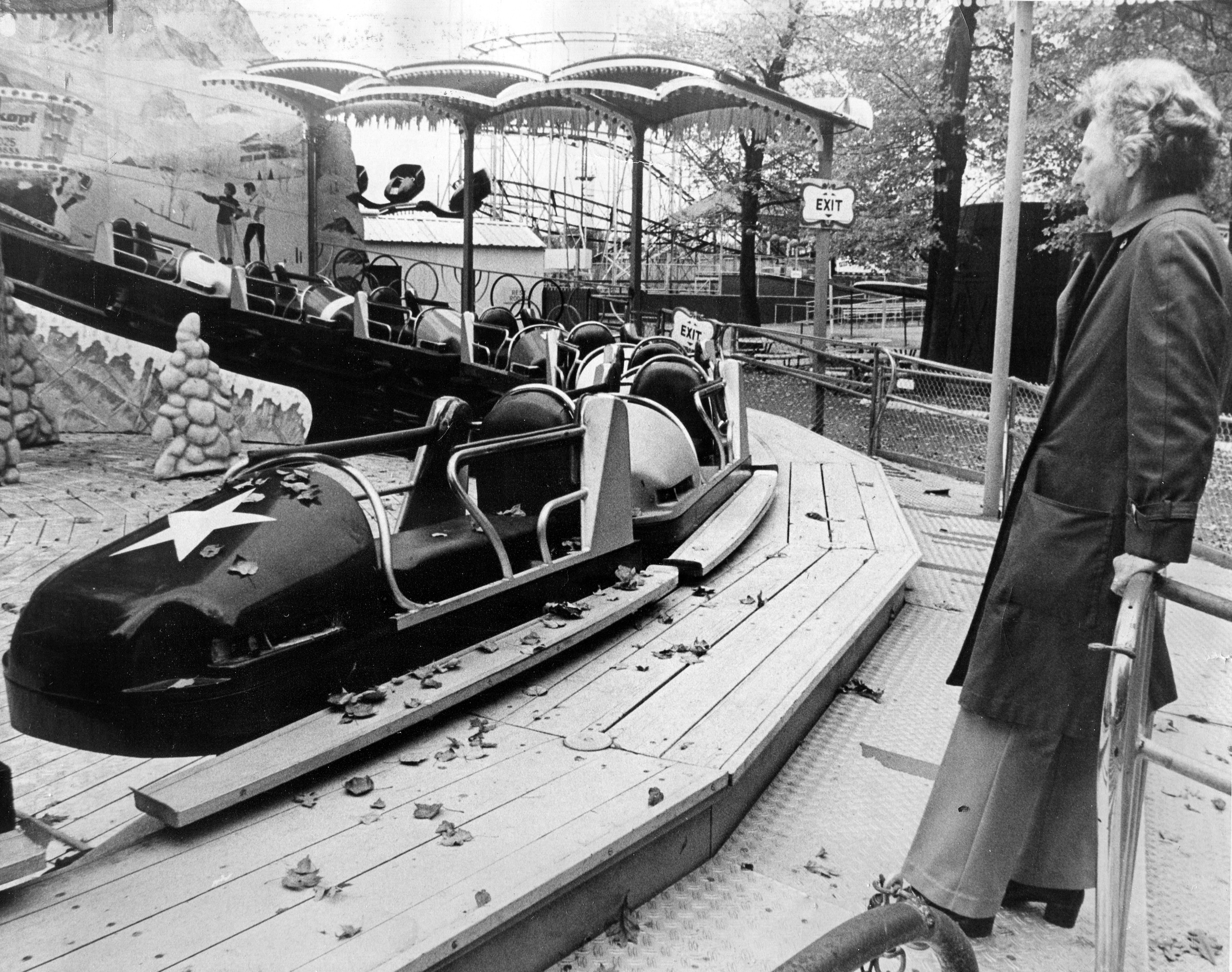 Oct. 6, 1978 - Agawam - Mildred Wender looks on as autumn leaves fall on one of the rides at Riverside Park. (Republican file photo) Staff-Shot