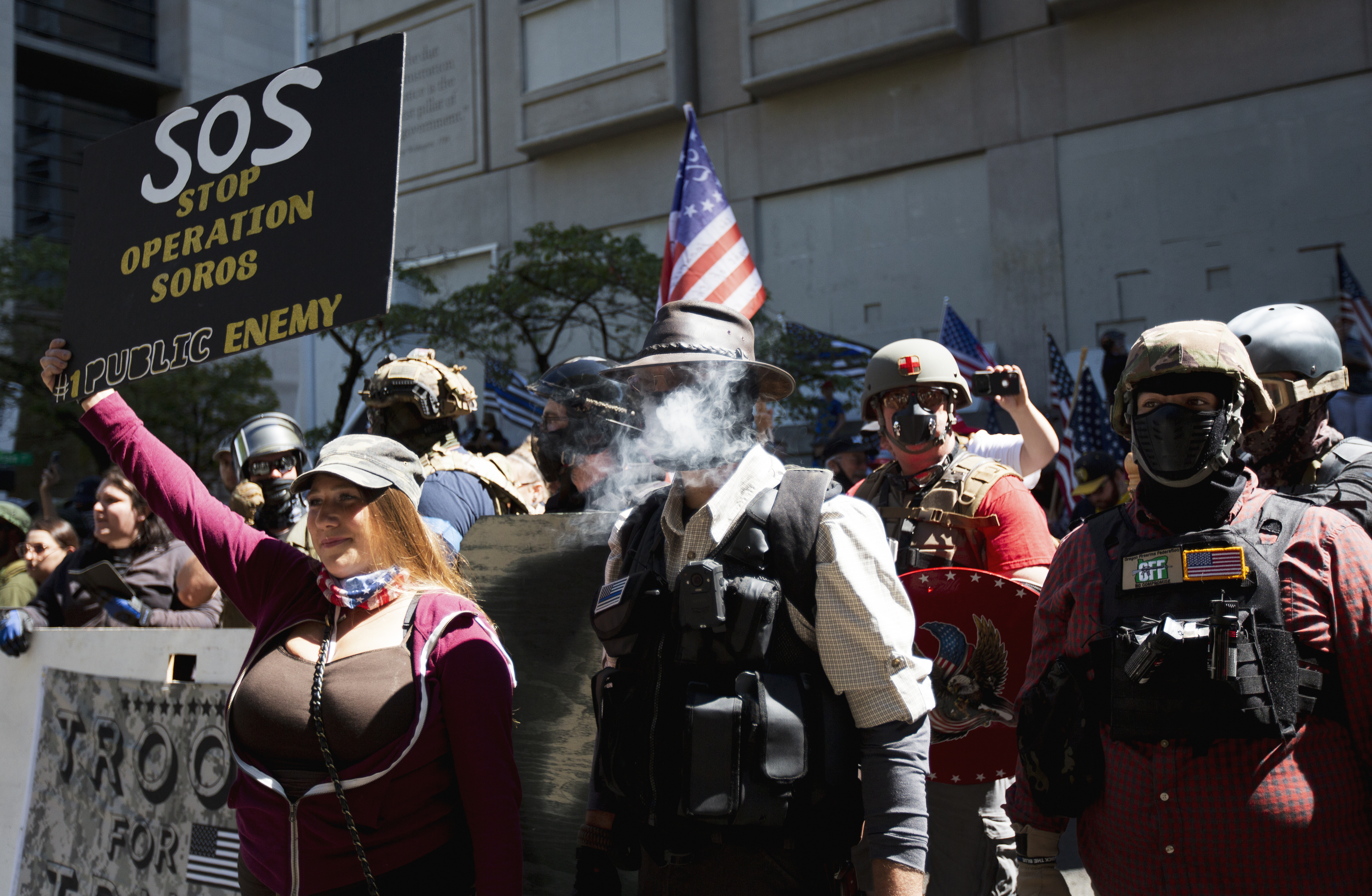 Fights break out as dueling protests clash in Portland, federal