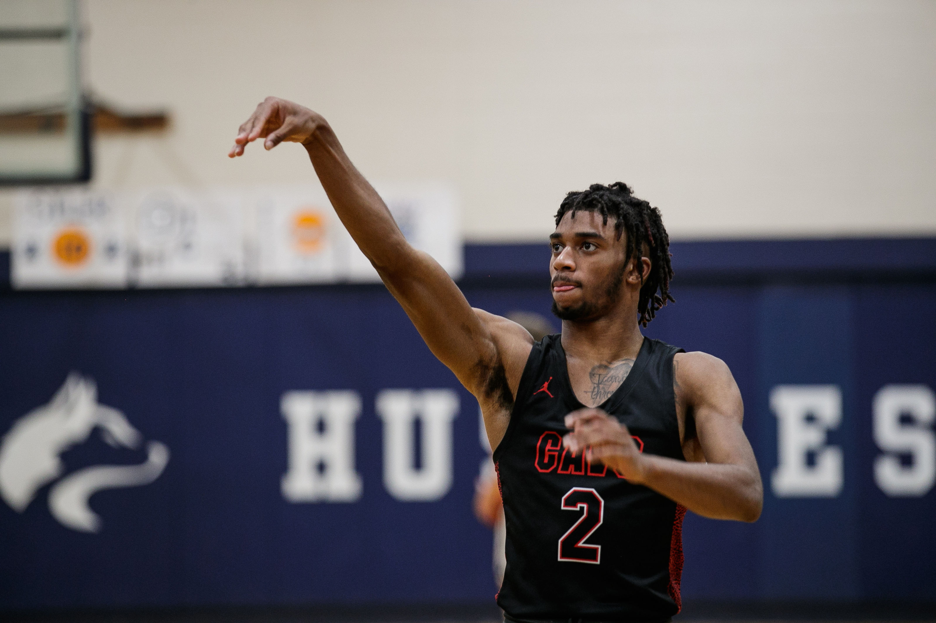 Carrollton boys varsity basketball team defeats Hemlock Huskies