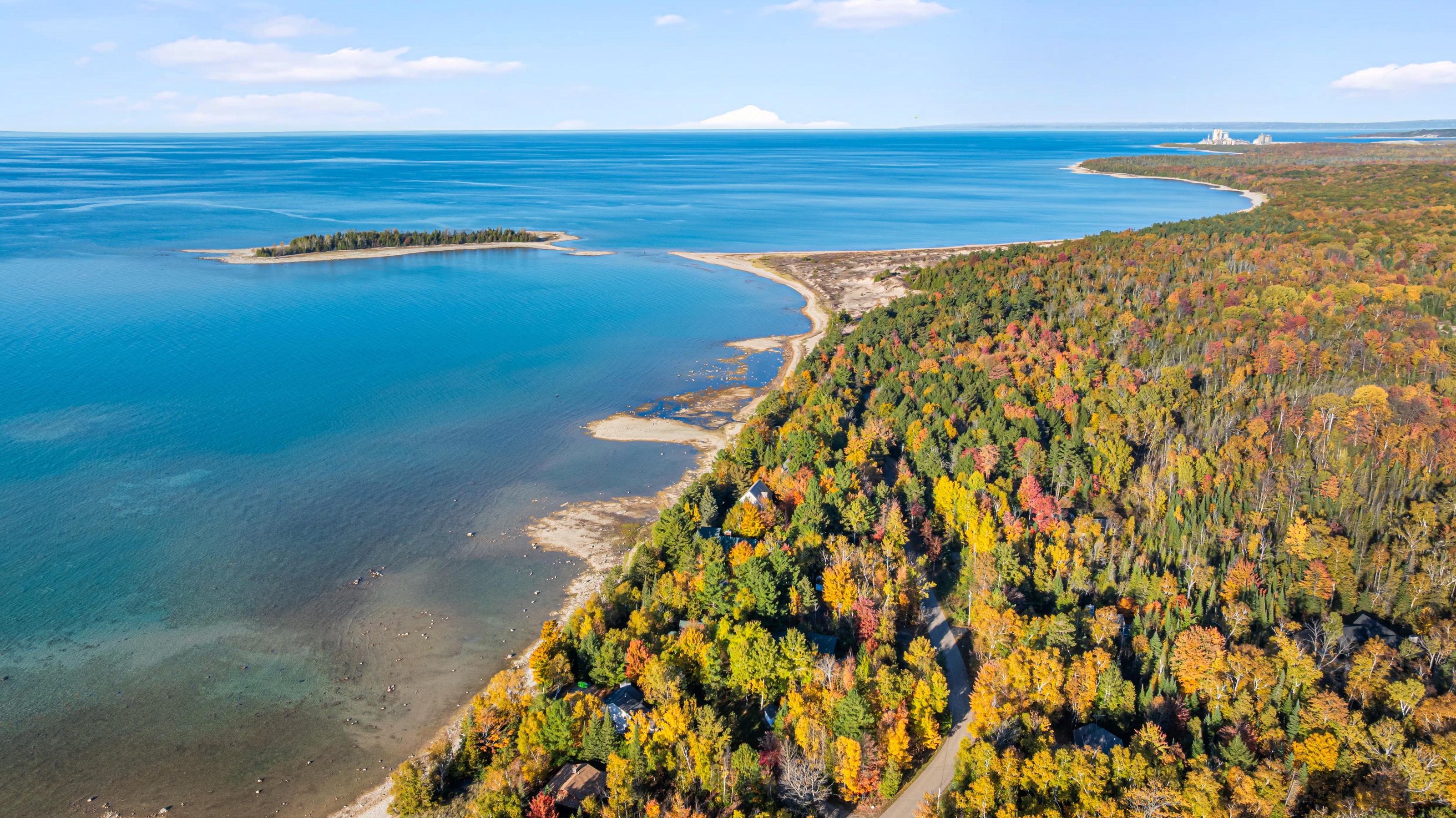 Aerial photographs of 4093 Lake Shore Drive in Charlevoix, this gem is listed at $2,099,900 through Berkshire Hathaway HomeServices Michigan Real Estate – Traverse City and The Crane Group with associate broker Johnny Crane and his brother, co-listing agent Matt Crane.