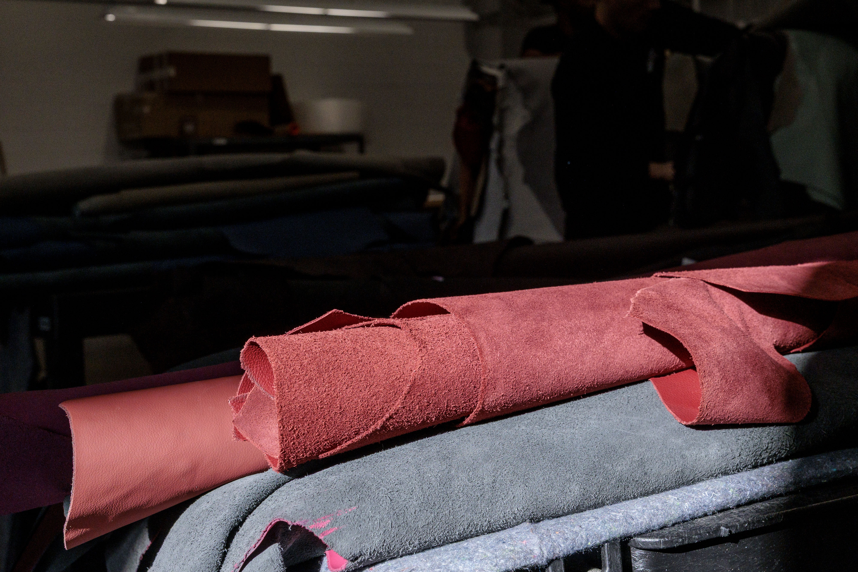 Rolls of automotive leather hides are stacked for donation at Pangea in Rochester Hills on Monday, Oct. 6 2025.