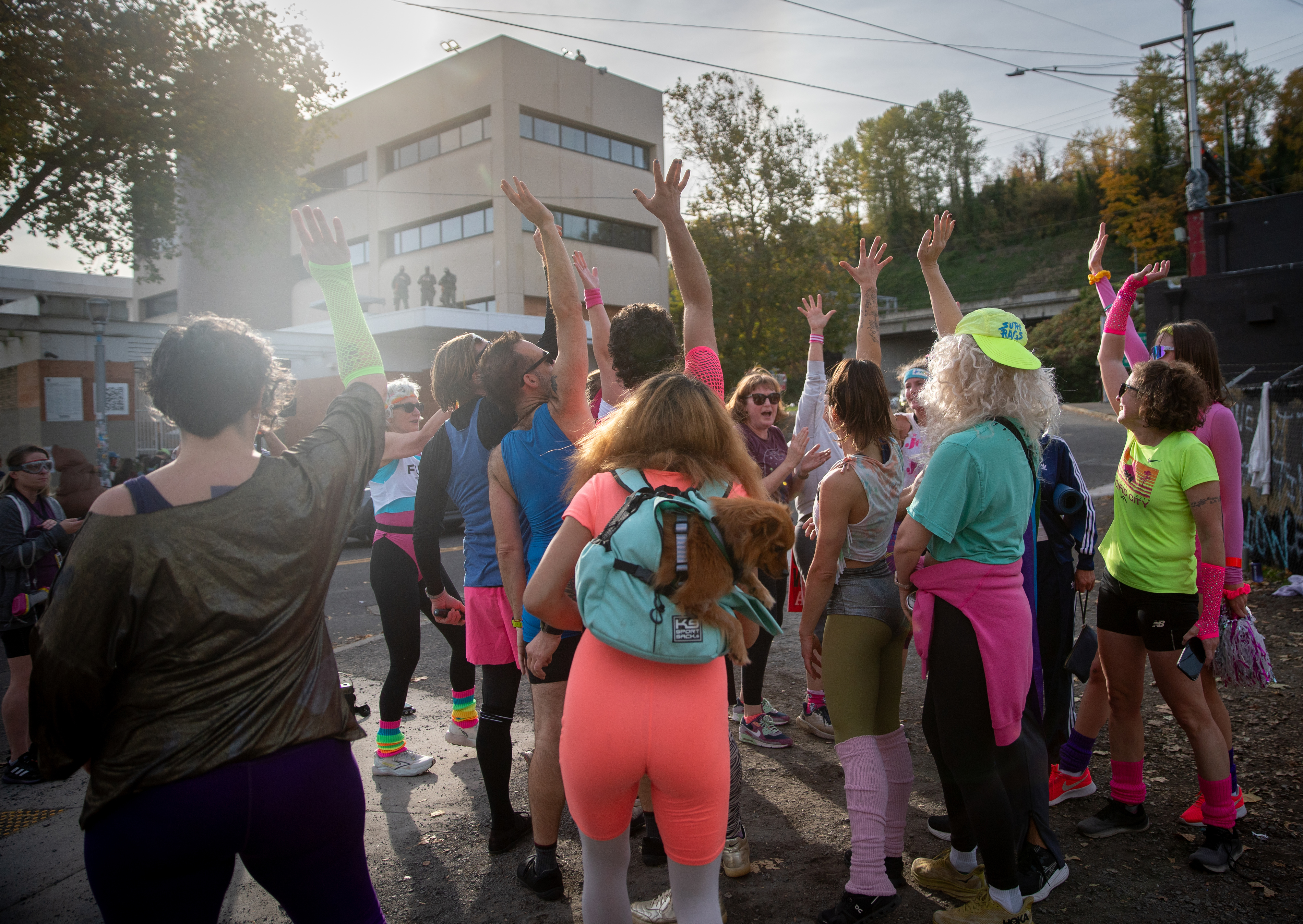 Participants in Fulcrum Fitness’s “Sweatin’ Out the Fascists” held an ’80s-aerobics peaceful protest outside the U.S. Immigration and Customs Enforcement (ICE) facility in South Portland on Sunday, Nov. 9, 2025, collecting donations for the Oregon Food Bank.