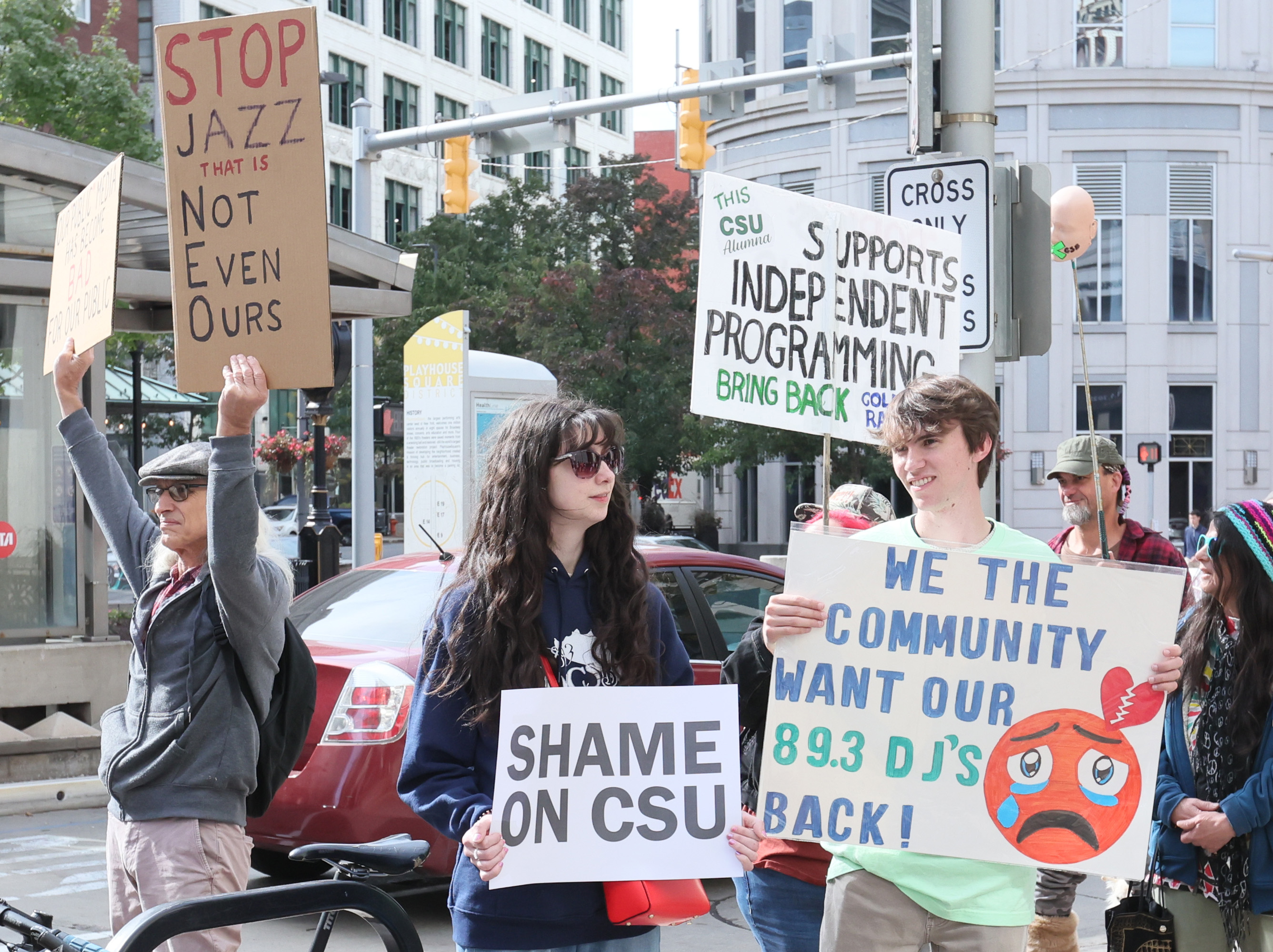 Protestors rally outside Cleveland’s City Club during lunch forum with ...