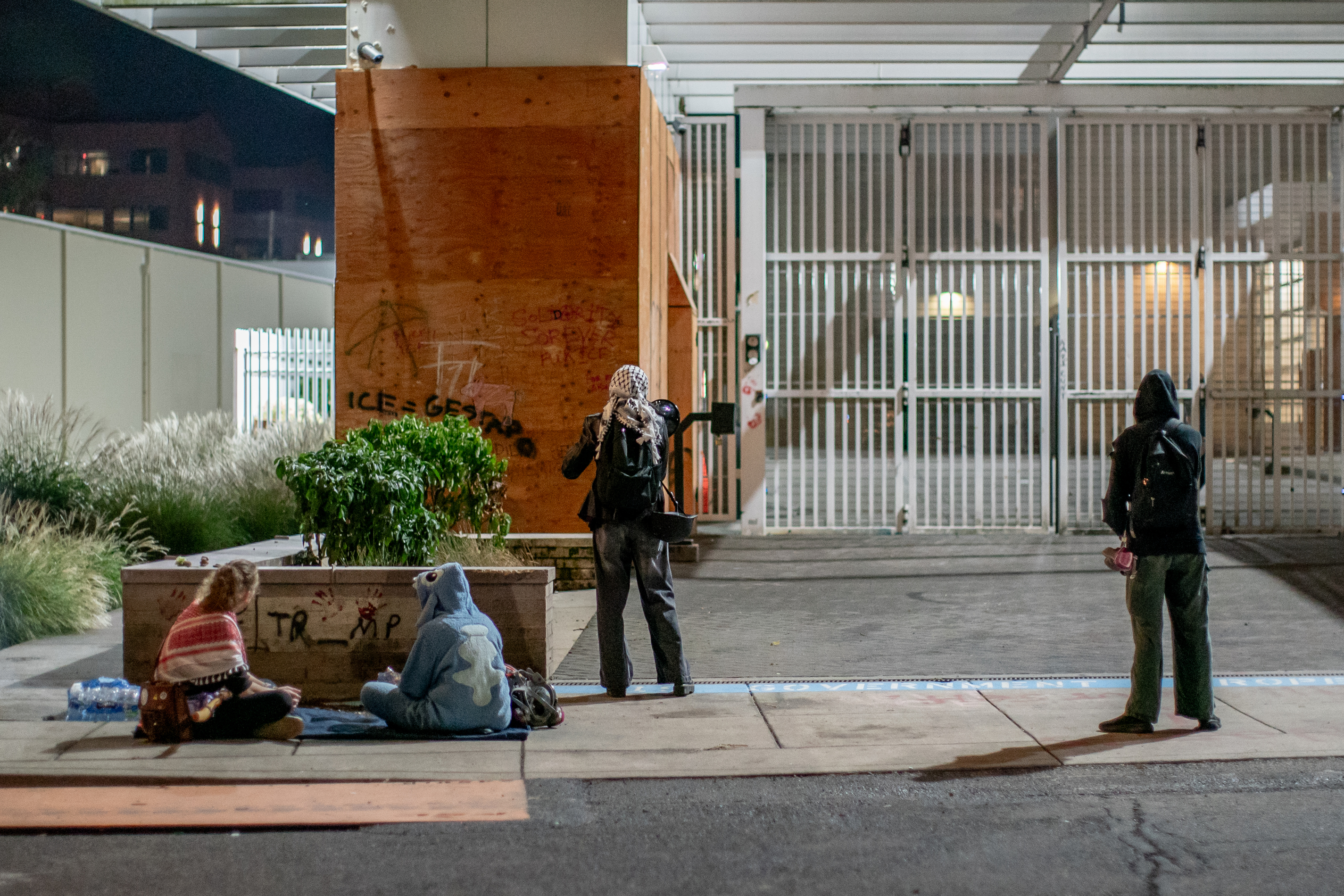 Protesters gather outside the boarded-up U.S. Immigration and Customs Enforcement building in South Portland on Monday, Sept. 8, 2025, days after President Donald Trump suggested federal intervention.