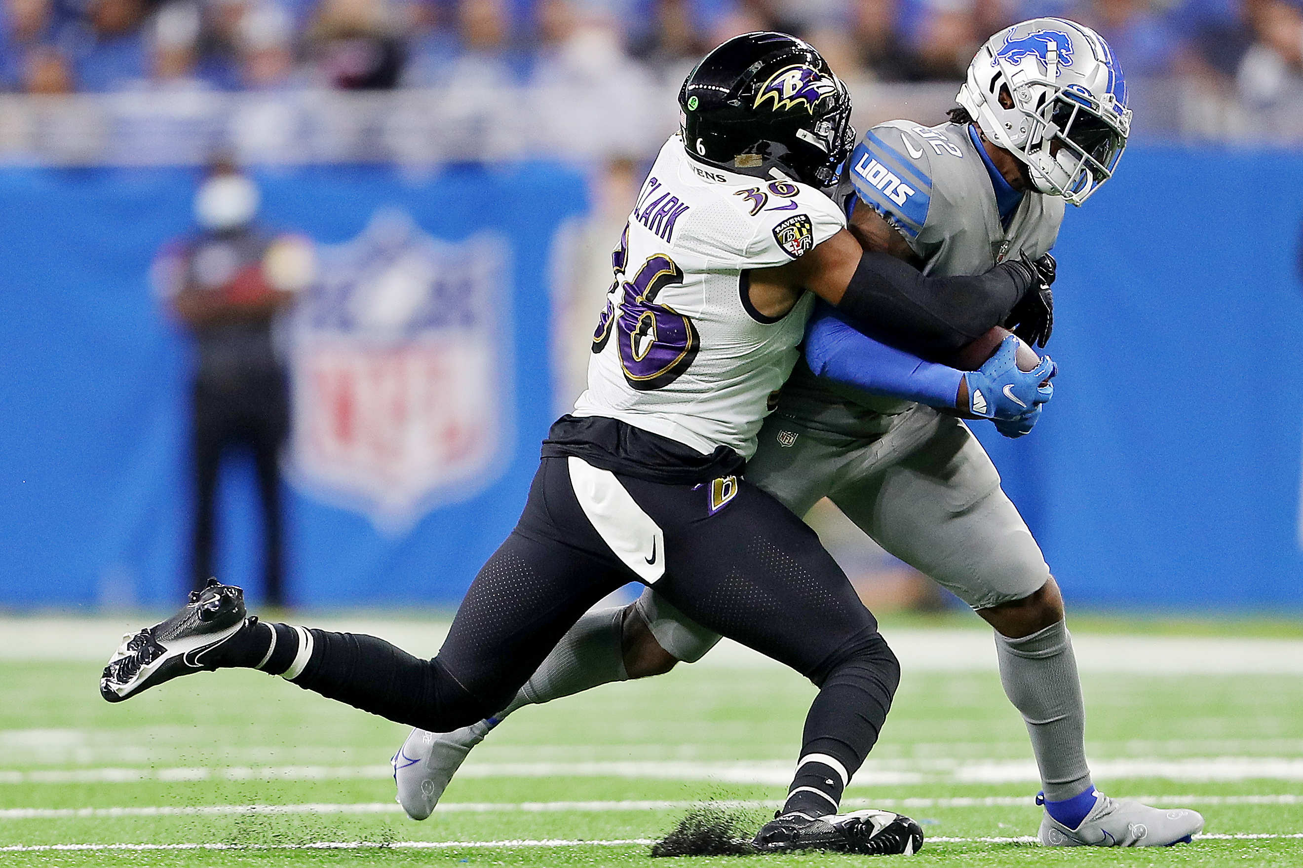 DETROIT, MI - SEPTEMBER 26: Baltimore Ravens quarterback Lamar Jackson (8)  gets sacked by Detroit Lions linebacker Alex Anzalone (34) in the fourth  quarter during NFL game between Baltimore Ravens and Detroit