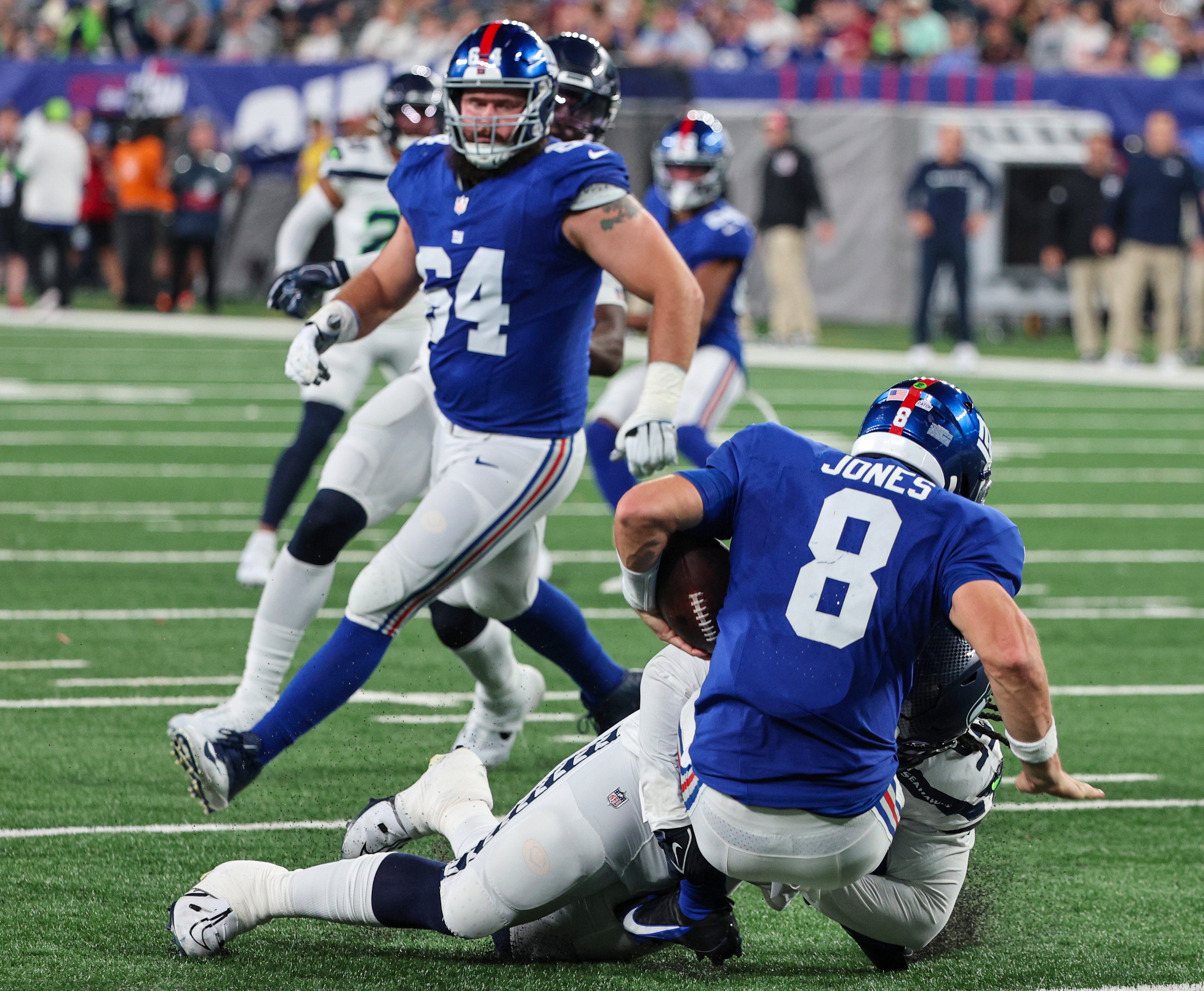 New York Giants guard Mark Glowinski (64) walks off the field