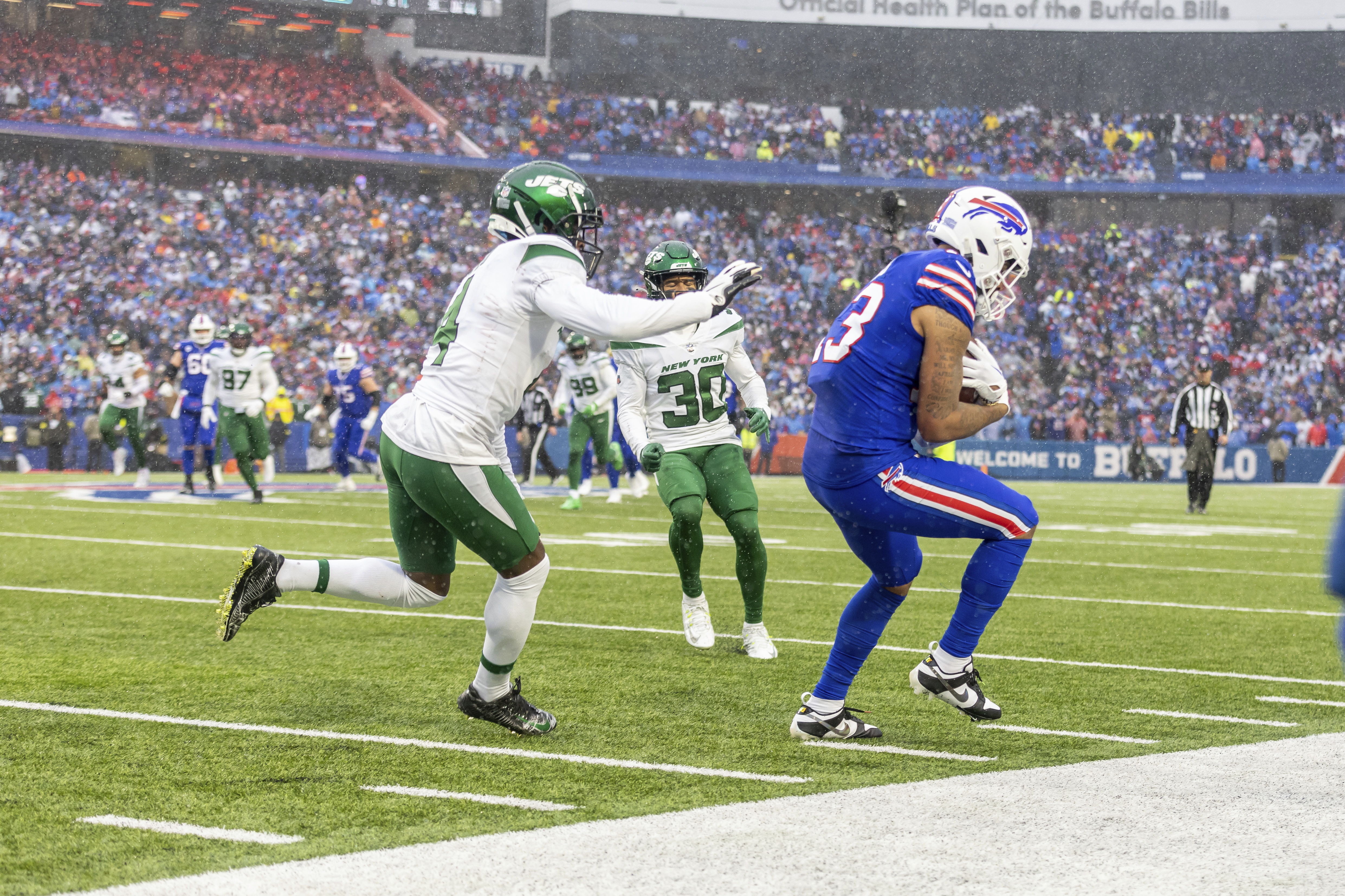 Buffalo Bills wide receiver Gabe Davis (13) catches a pass and runs against  the New York Jets in an NFL football game, Sunday, Dec. 11, 2022, in  Orchard Park, N.Y. Bills won