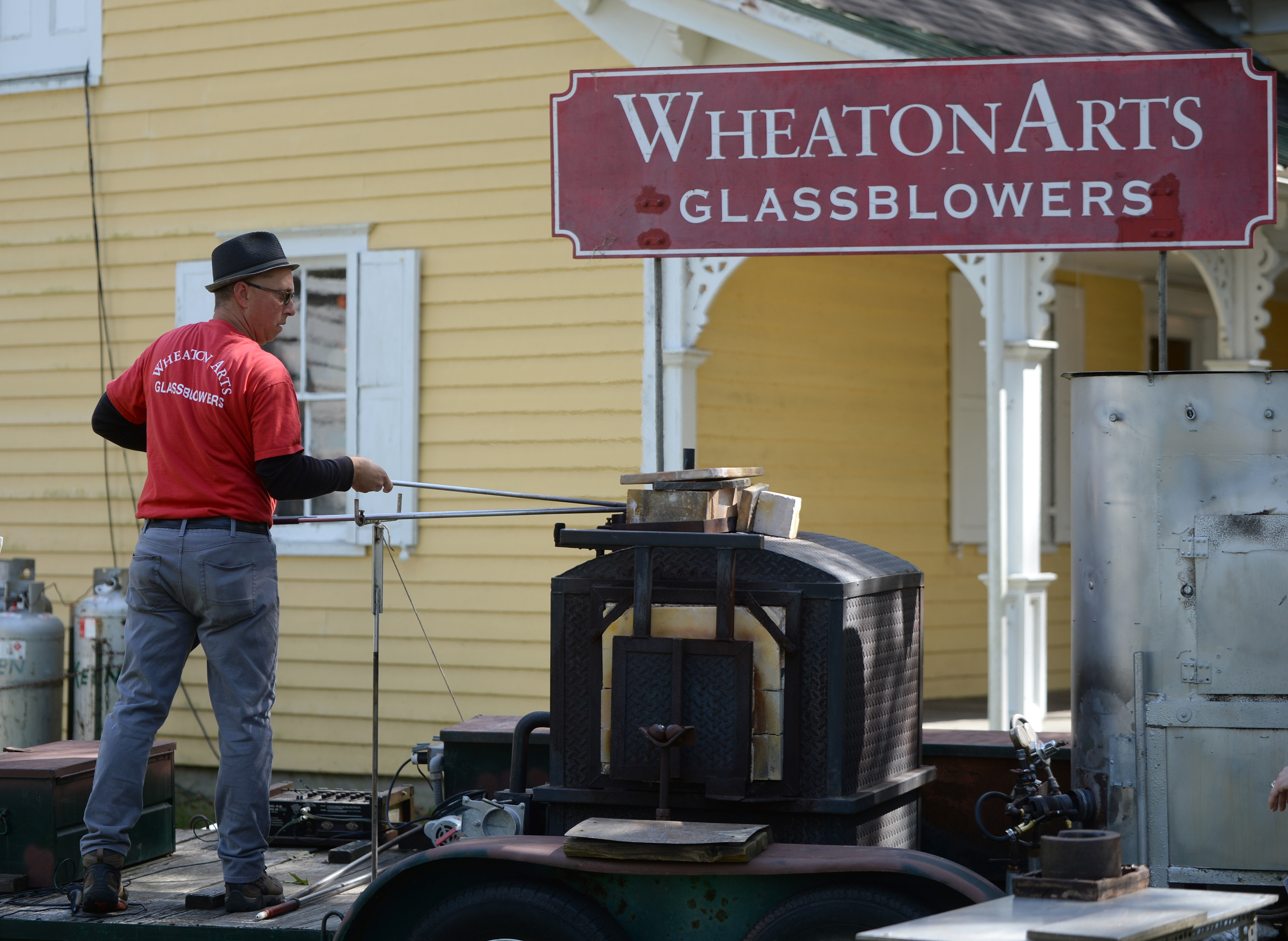 Wheaton arts Traveling Glassblowers give a glass bowling demonstration during the 22nd annual Festival of Fine Craft at Wheaton Arts in Millville, Saturday, Oct. 2, 2021.