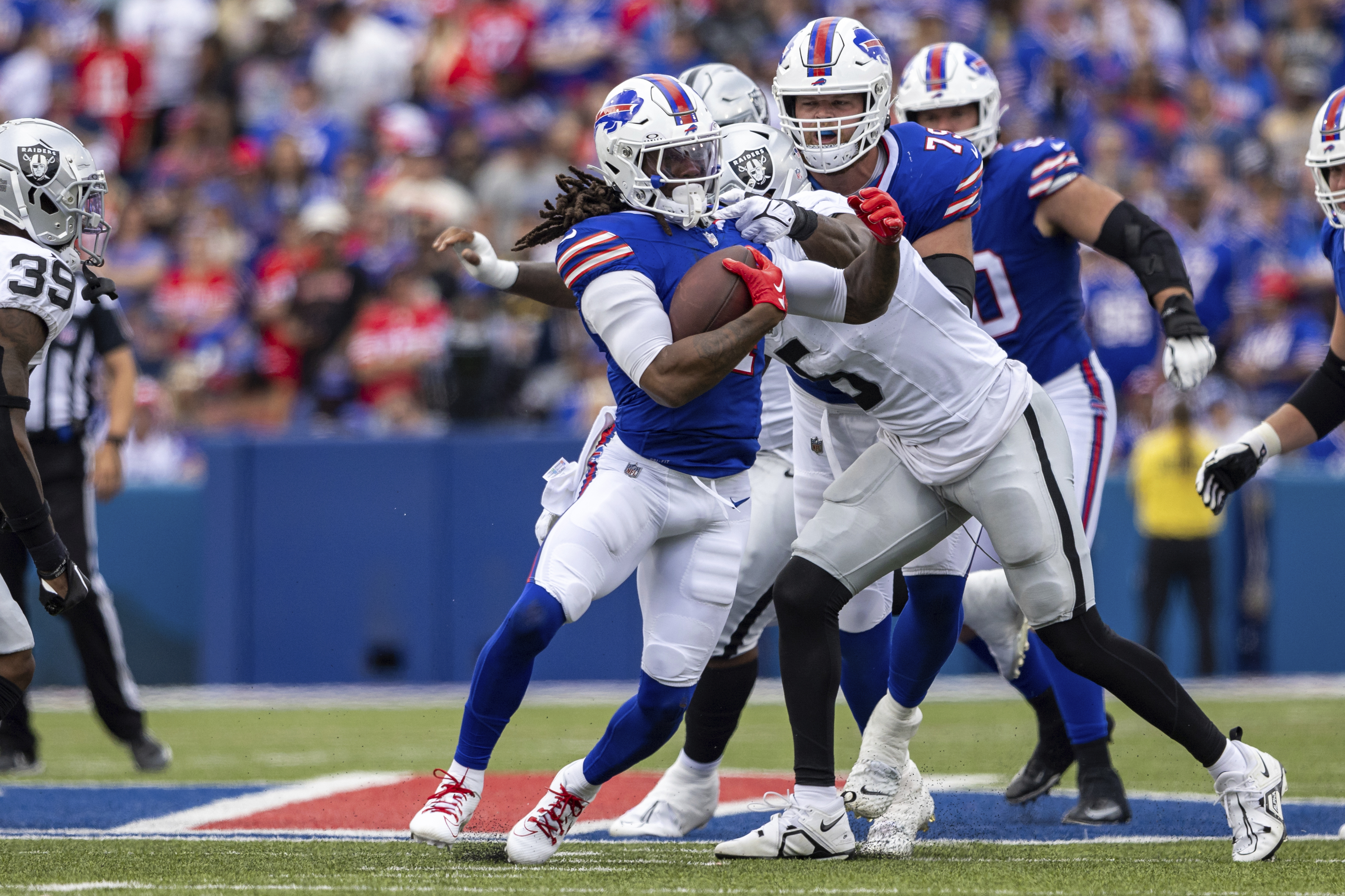 Buffalo Bills' Dorian Williams (42) tackles Las Vegas Raiders' Zamir White  (35) during the second half of an NFL football game, Sunday, Sept. 17,  2023, in Orchard Park, N.Y. The Bills won