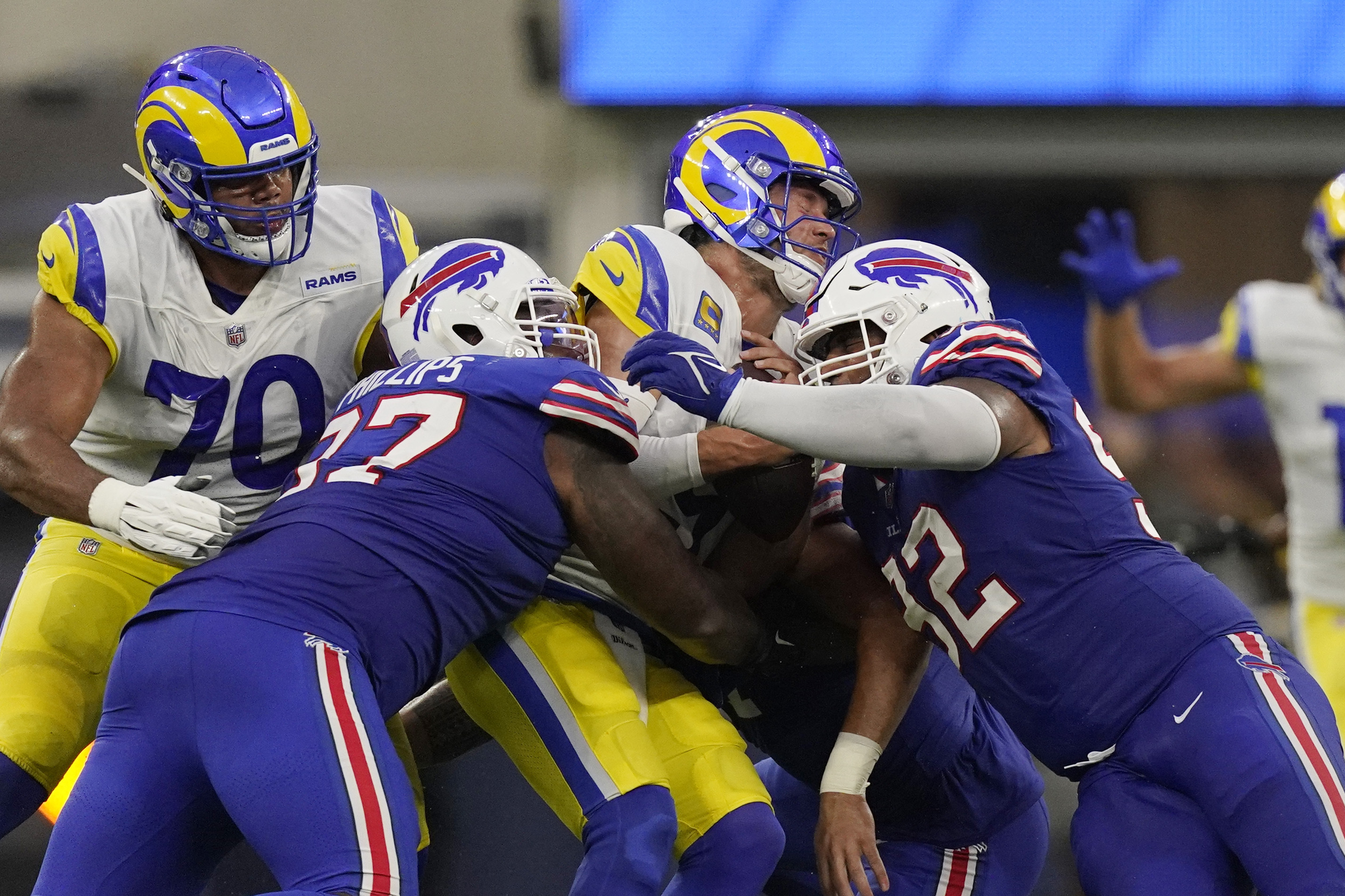 Los Angeles Rams' David Long Jr. (22), Ernest Jones (50) and Aaron Donald  celebrate with teamma …