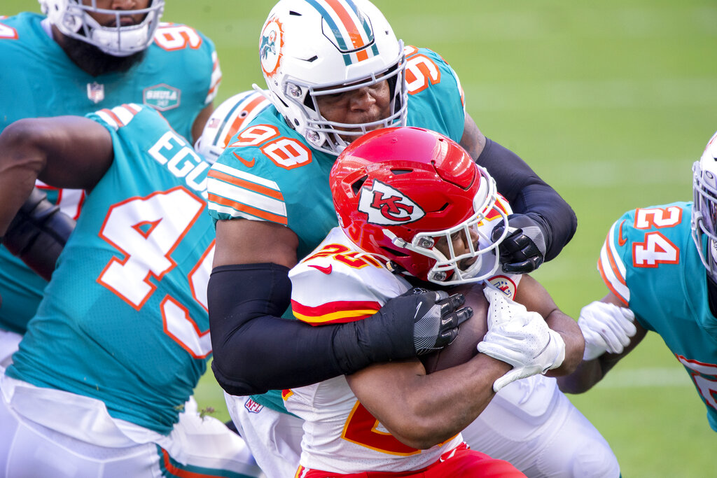 Miami Dolphins nose tackle Raekwon Davis (98) walks off the field