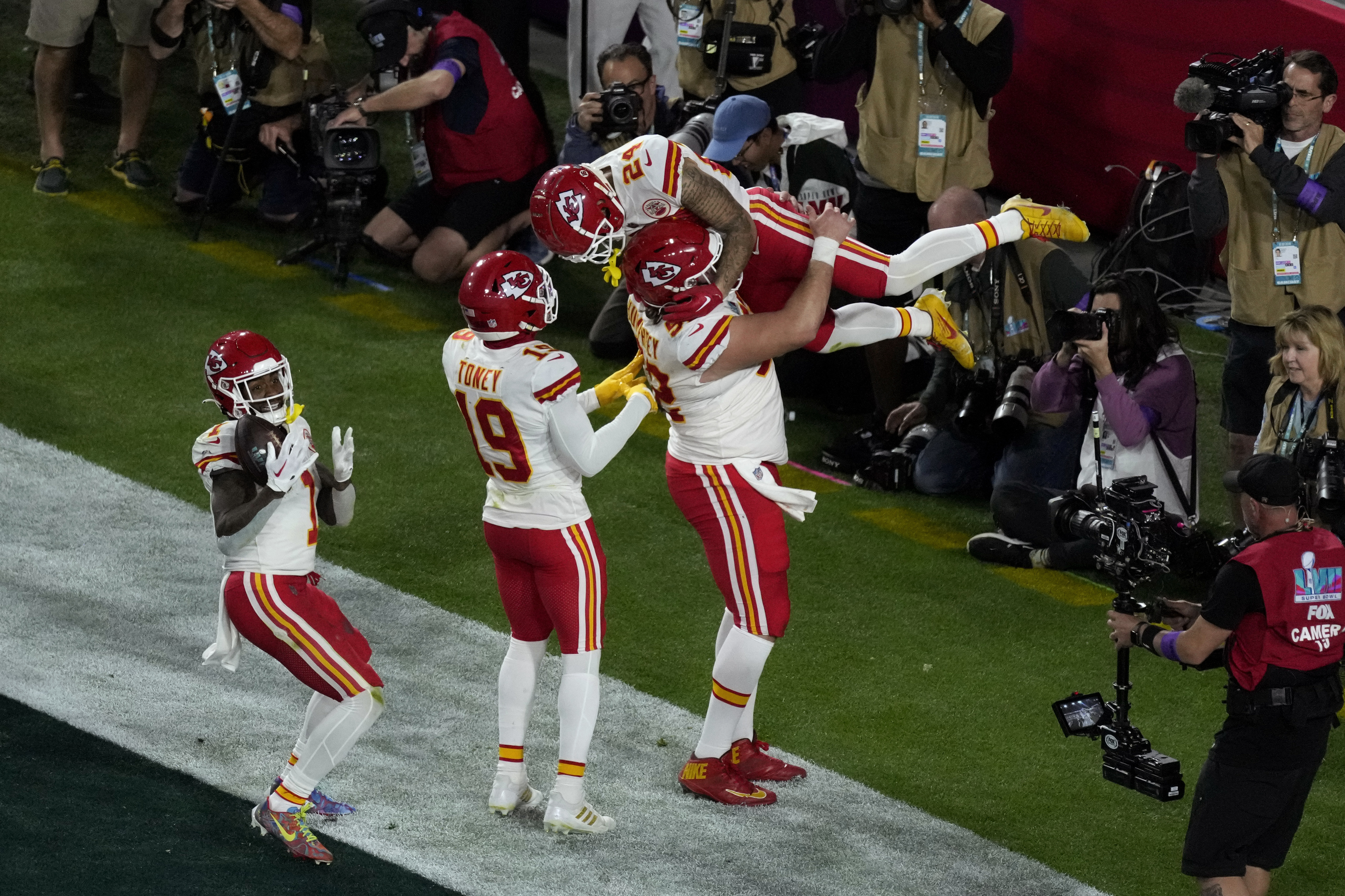 Kansas City Chiefs center Creed Humphrey (52) snaps the ball to