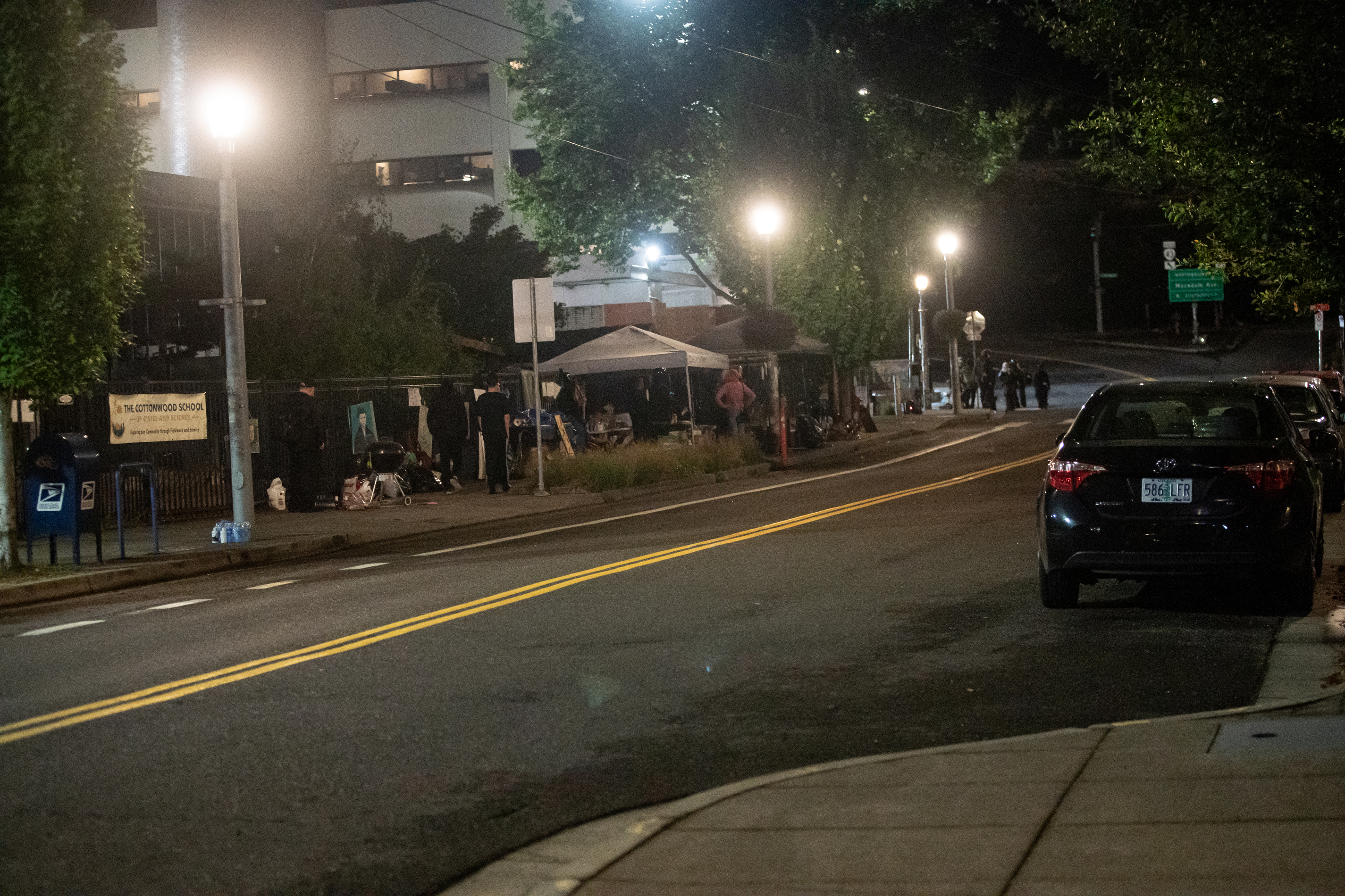 Protesters gather outside the boarded-up U.S. Immigration and Customs Enforcement building in South Portland on Monday, Sept. 8, 2025, days after President Donald Trump suggested federal intervention.