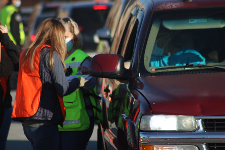 Hundreds line up for drive-thru flu shots at Coca-Cola Park in ...