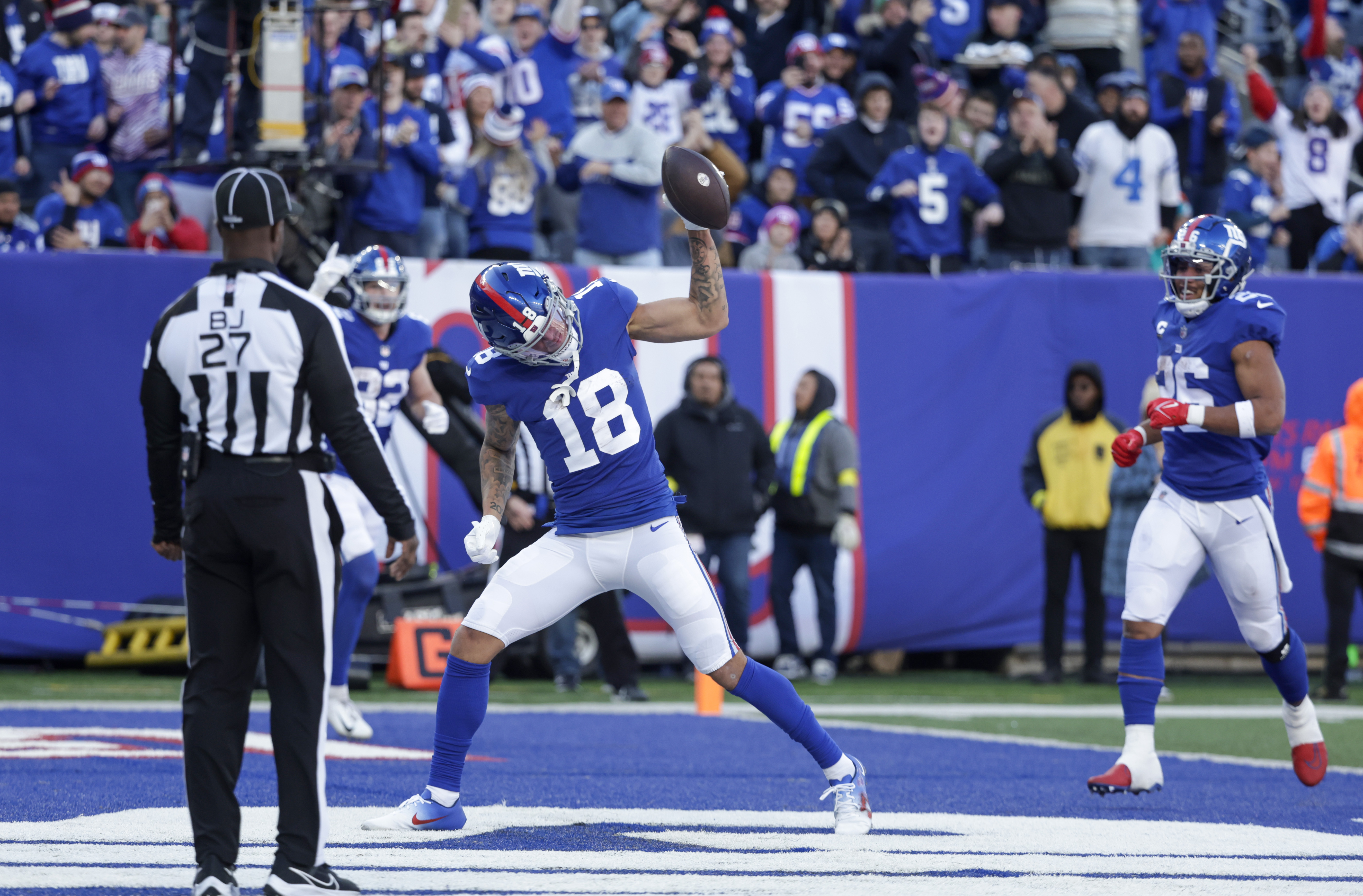 January 1, 2023, East Rutherford, New Jersey, USA: New York Giants wide  receiver Isaiah Hodgins (18) spikes the ball in the end zone after a  touchdown in the first half during a