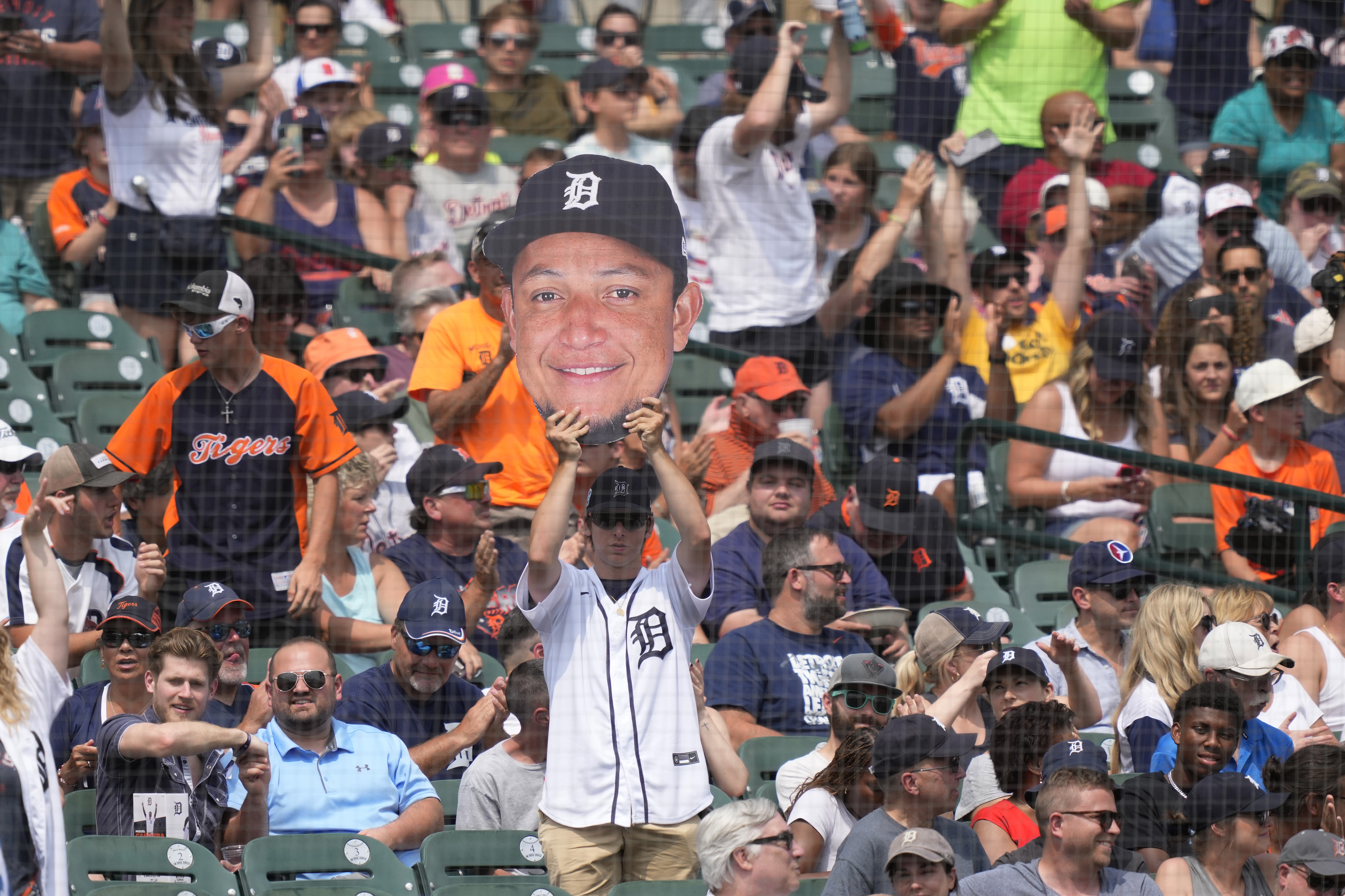 Young fan changes into a Cabrera jersey 