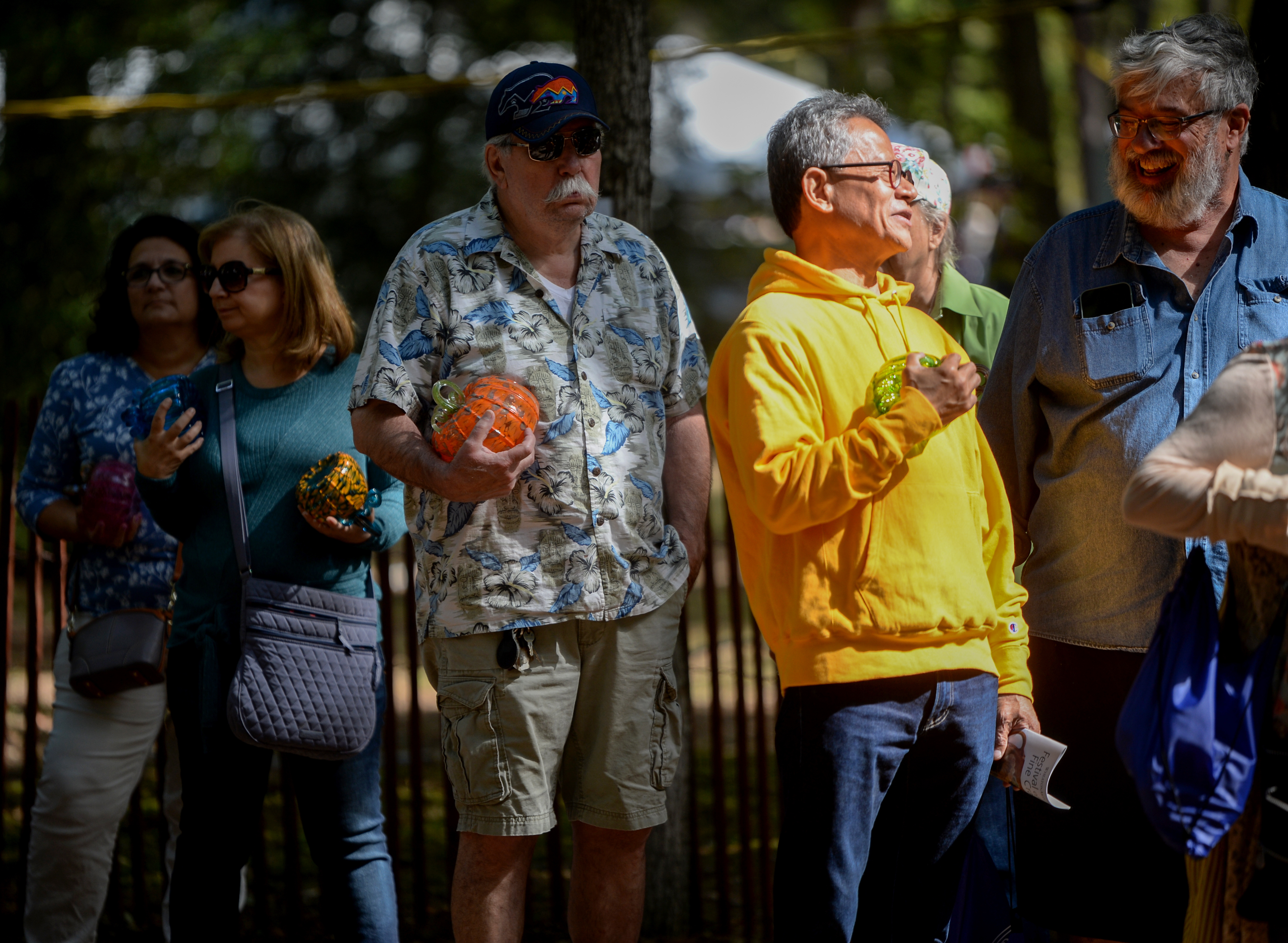 Customers wait in long lines to purchase limited edition handcrafted glass pumpkins during the 22nd annual Festival of Fine Craft at Wheaton Arts in Millville, Saturday, Oct. 2, 2021.