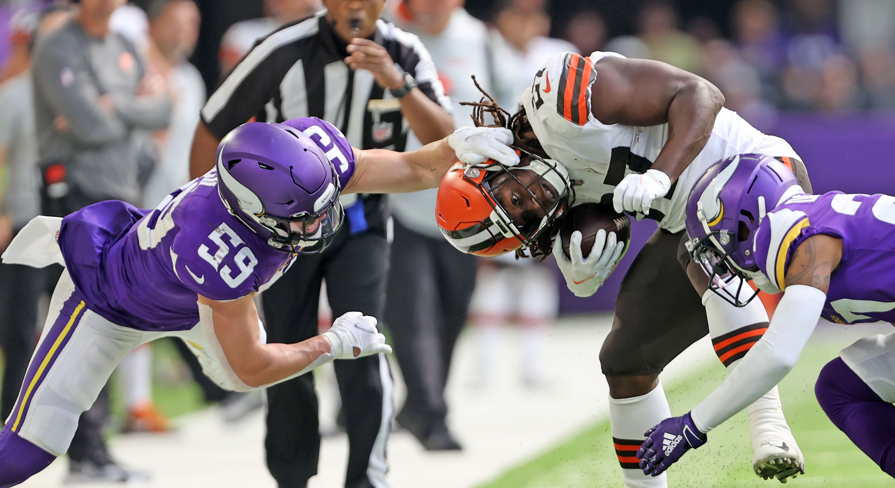 Cleveland Browns wide receiver Odell Beckham Jr. (13) is tackled by Minnesota  Vikings free safety Harrison Smith (22) and free safety Xavier Woods (23)  after catching a pass during the second half