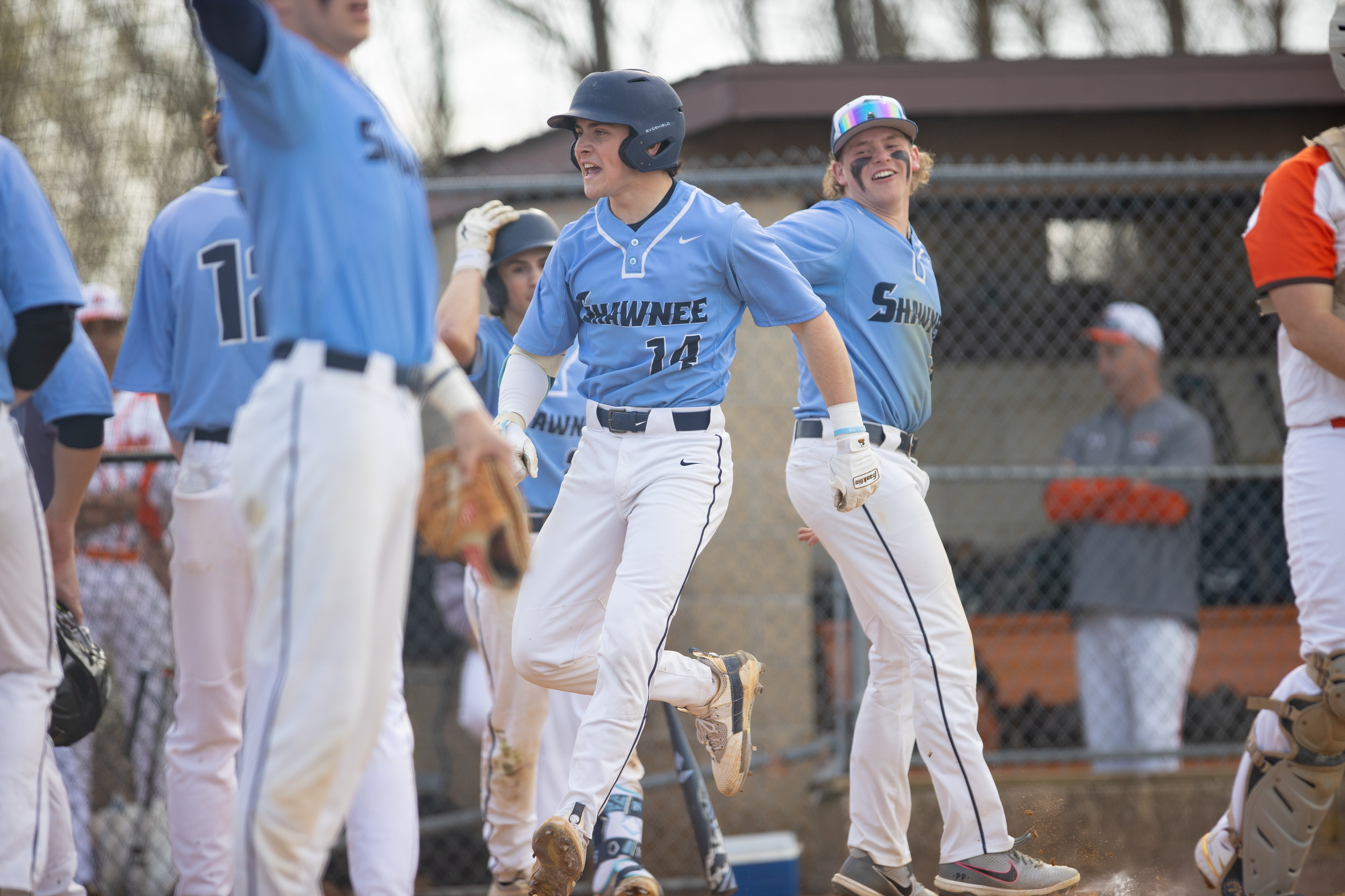 Reid Uccello (14) of Shawnee, celebrates after hitting a home run in Marlton, NJ on Monday, April 3, 2023.