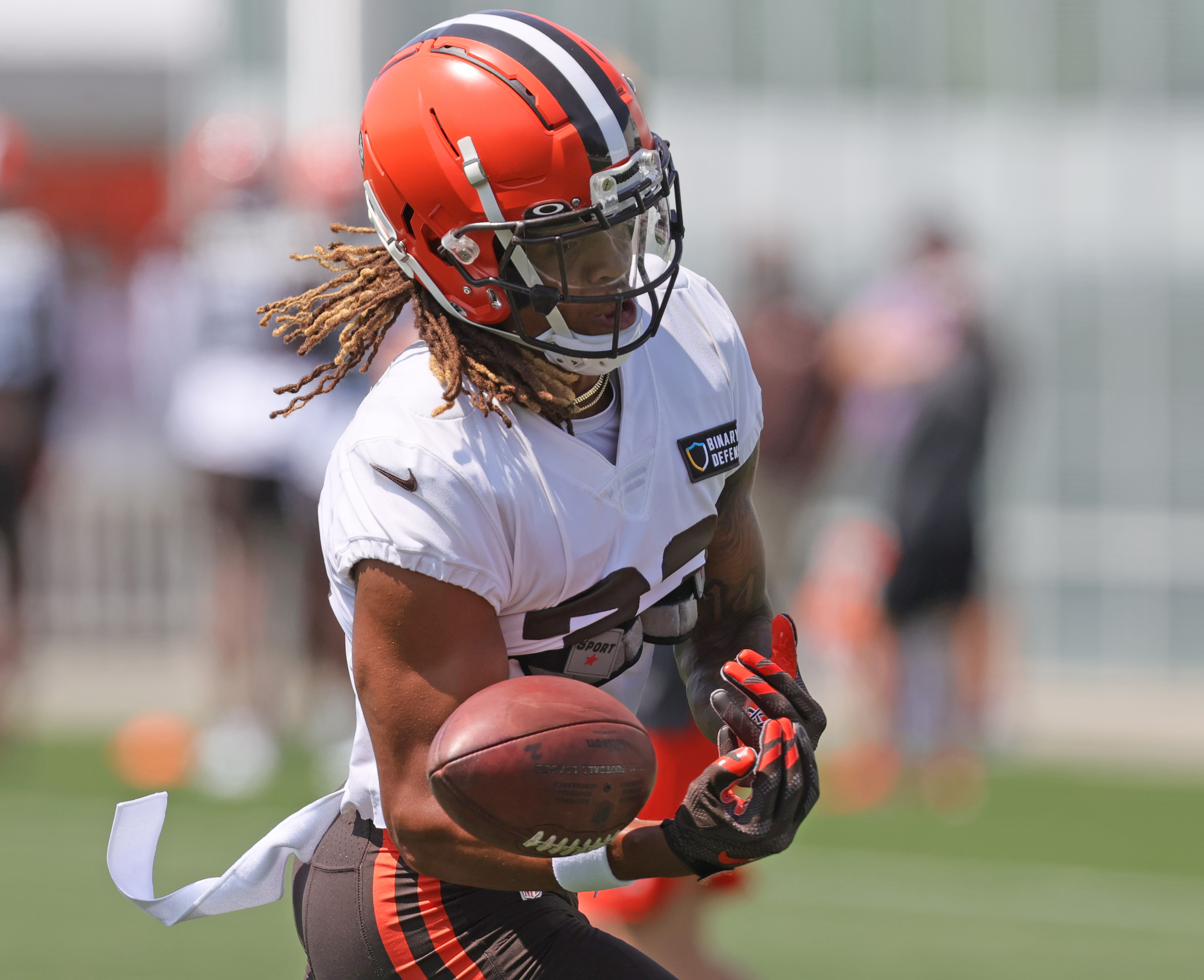 Cleveland Browns safety Ronnie Hickman Jr. intercepts a pass in front of Philadelphia  Eagles tight end Grant Calcaterra (81) during the first half of an NFL  preseason football game Thursday, Aug. 17