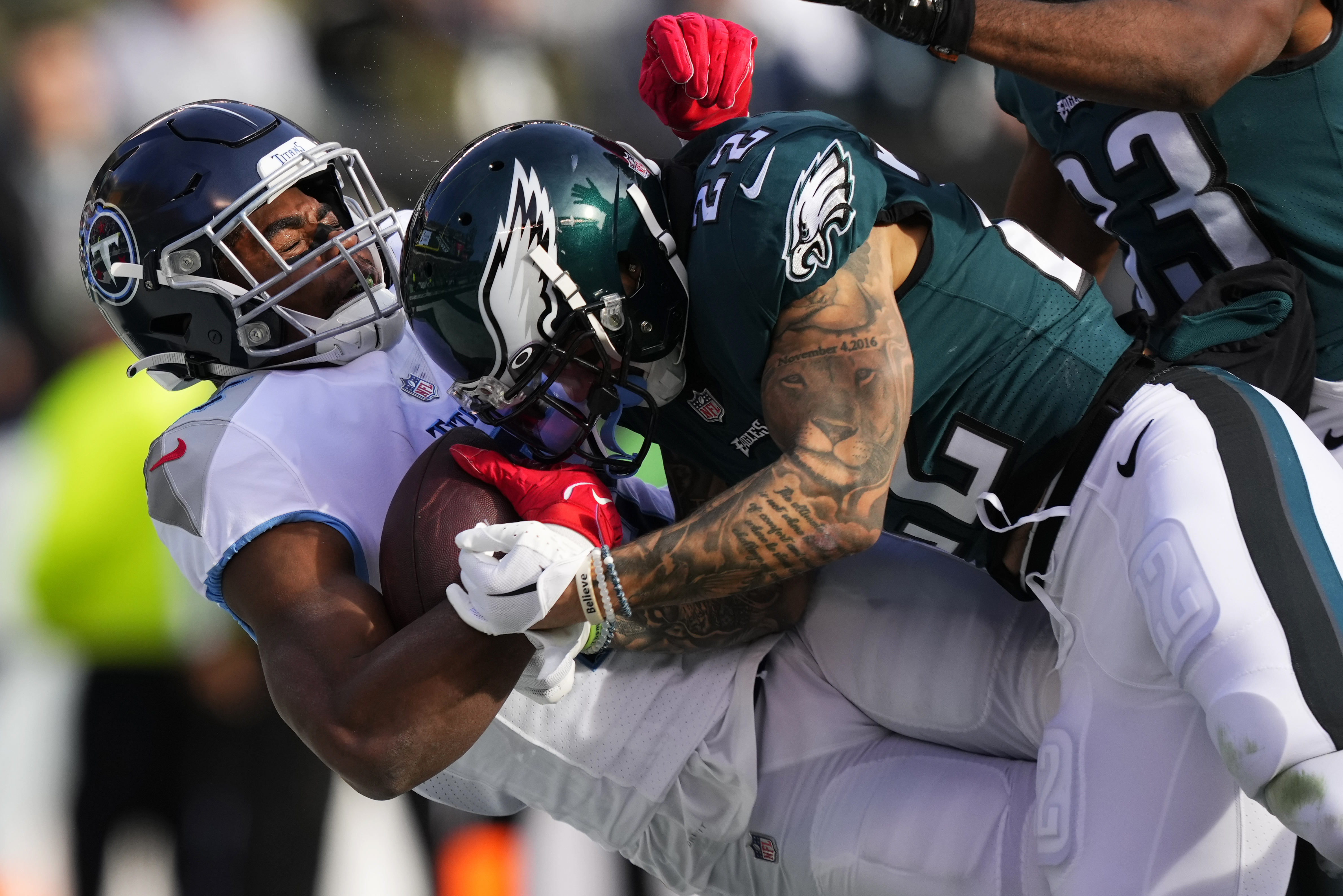 Hurts throws for 3 TDs, runs for another as Eagles rout Titans