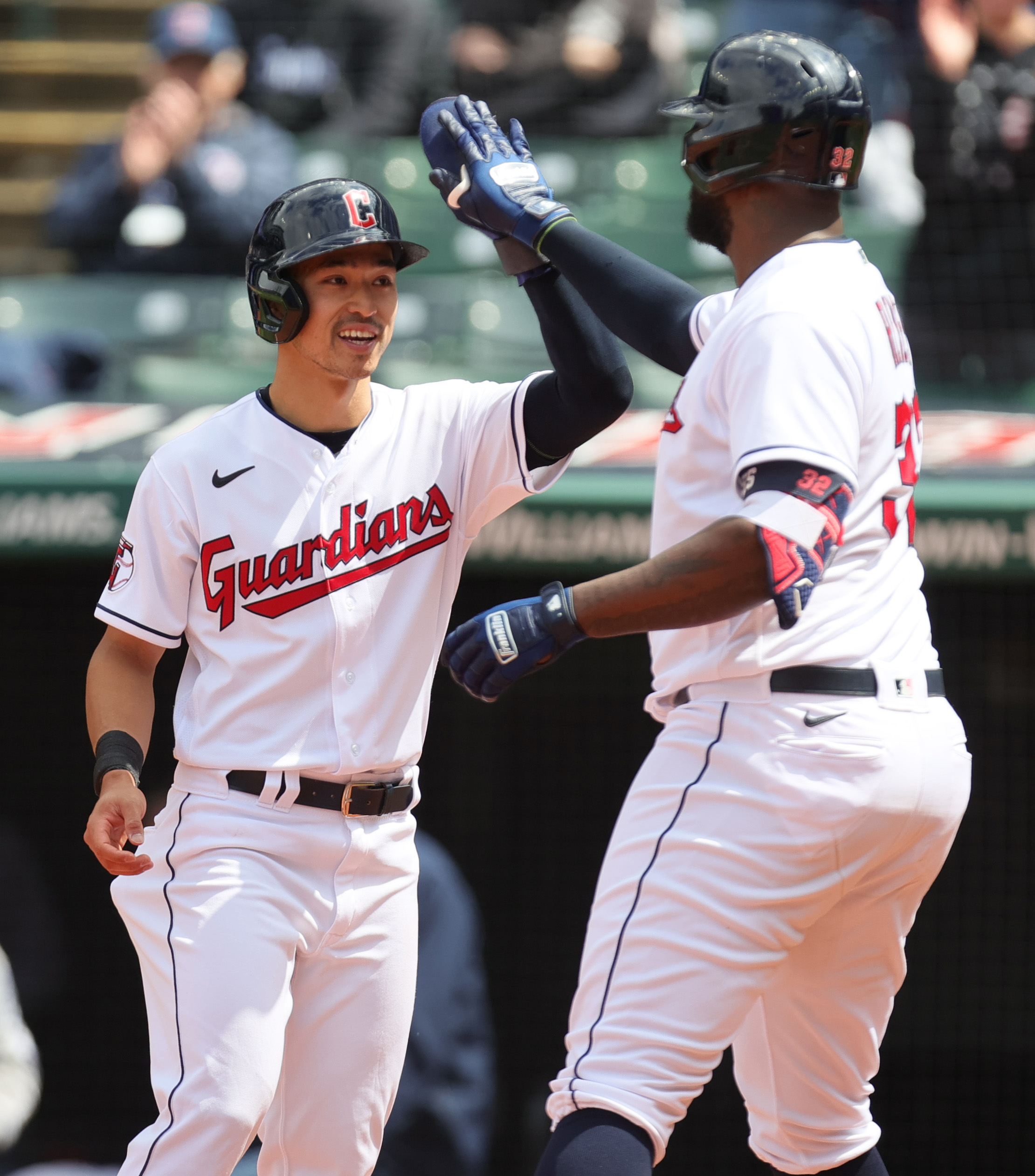 Chicago White Sox left fielder Eloy Jimenez, right, is congratulated by  center fielder Luis Robert after catching a fly ball hit by Cleveland  Guardians' Jose Ramirez during the sixth inning of a