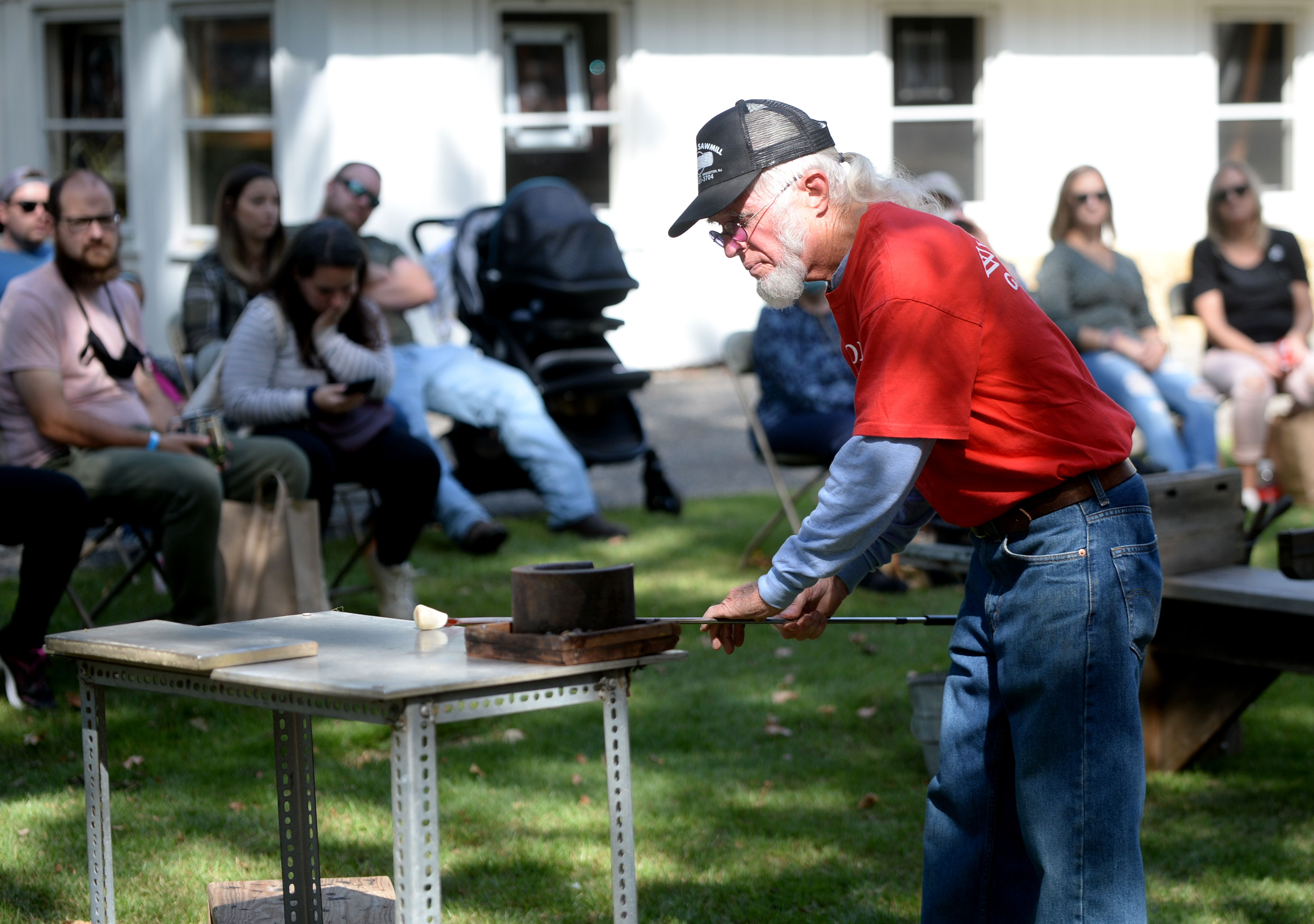 Wheaton arts Traveling Glassblowers give a glass bowling demonstration during the 22nd annual Festival of Fine Craft at Wheaton Arts in Millville, Saturday, Oct. 2, 2021.
