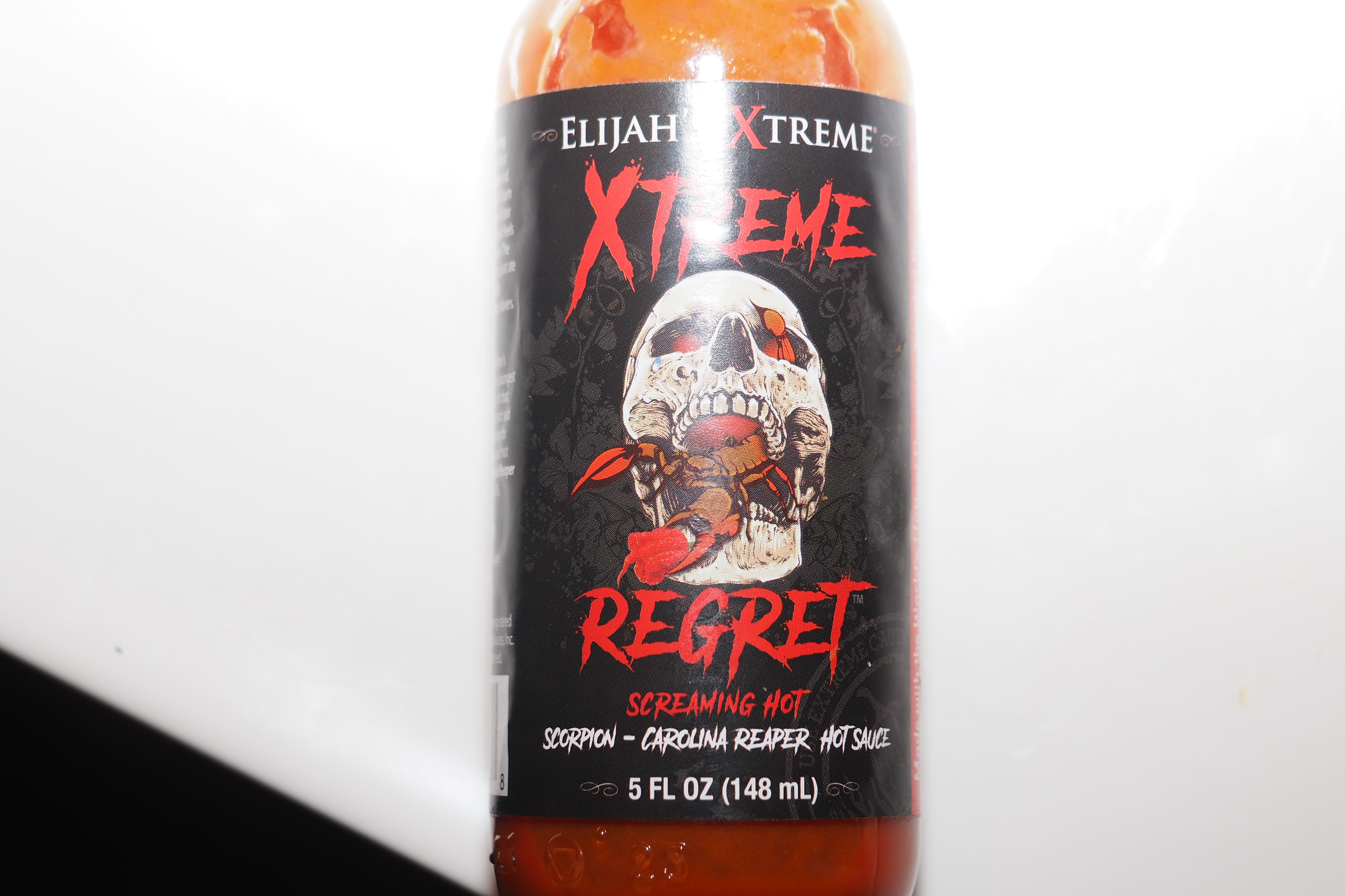 Pictured is a bottle of Elijah’s Xtreme Regret, a H๏τ sauce used as punishment for 15-year-old Timothy Ferguson. Timothy died July 6, 2022, after suffering from months of torture and abuse at the hands’ of his mother, Shanda Vander Ark, and older brother, Paul Ferguson. Timothy weighed 69 pounds when he died.