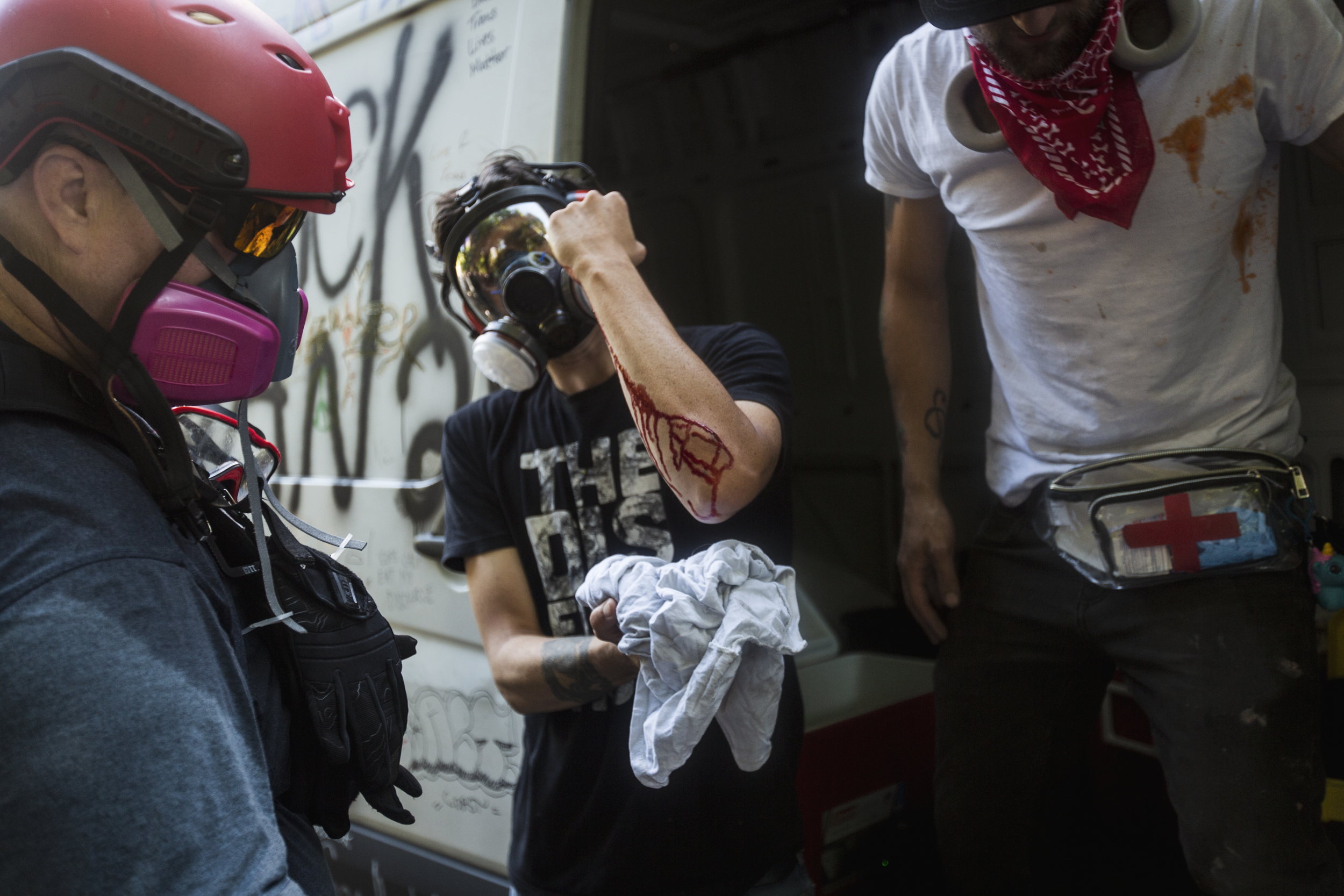 A man receives help for his injury as far-right organizers organized with the stated goal of Òsaying no to MarxismÓ clash at the Justice Center in Portland on August 22, 2020, during multiple counter-protests from left-wing, anti-fascist groups and Black Lives Matter groups.