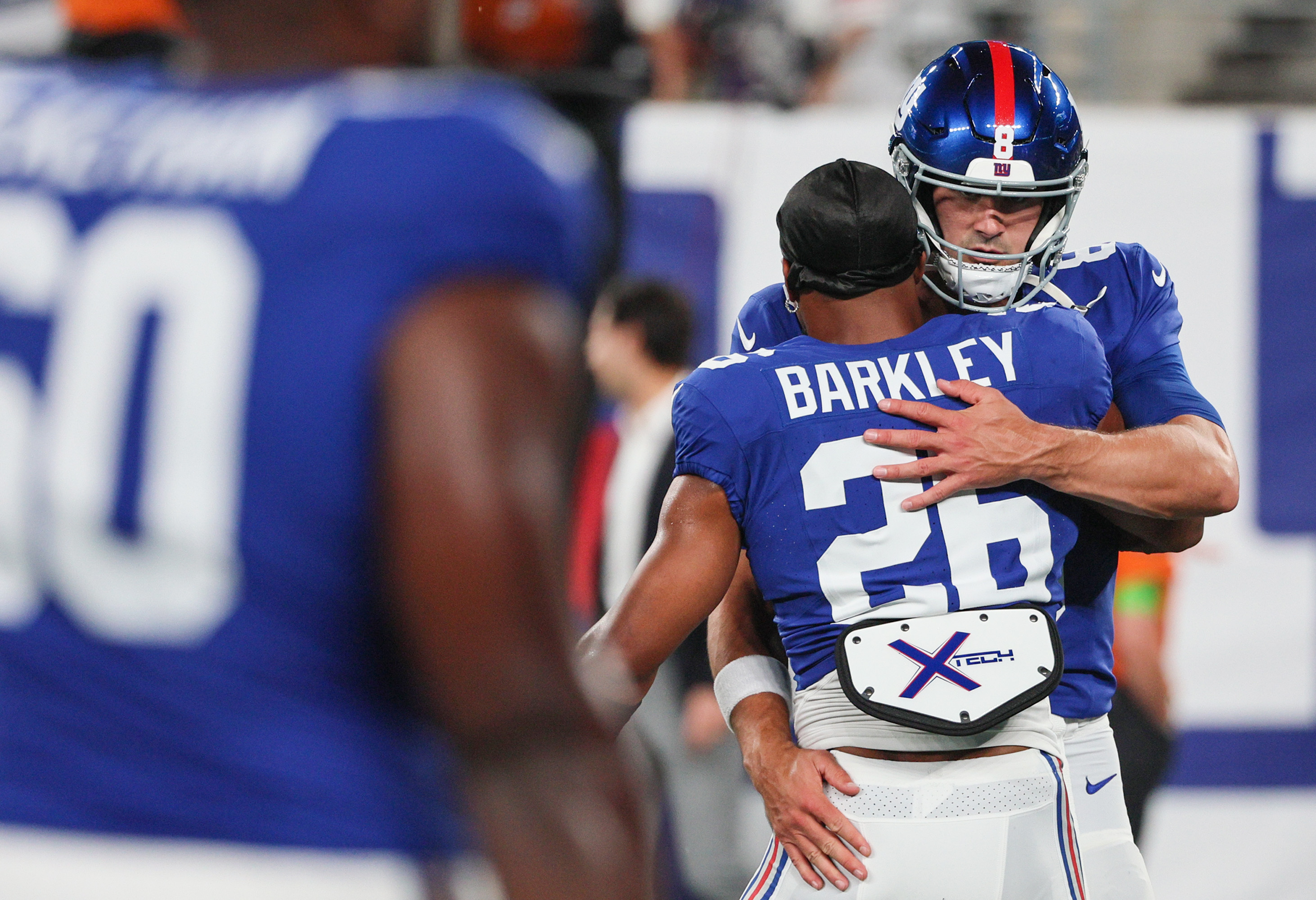 Dallas Cowboys' DaRon Bland, right, intercepts a pass intended for New York  Giants' Saquon Barkley, left, during the first half of an NFL football  game, Sunday, Sept. 10, 2023, in East Rutherford