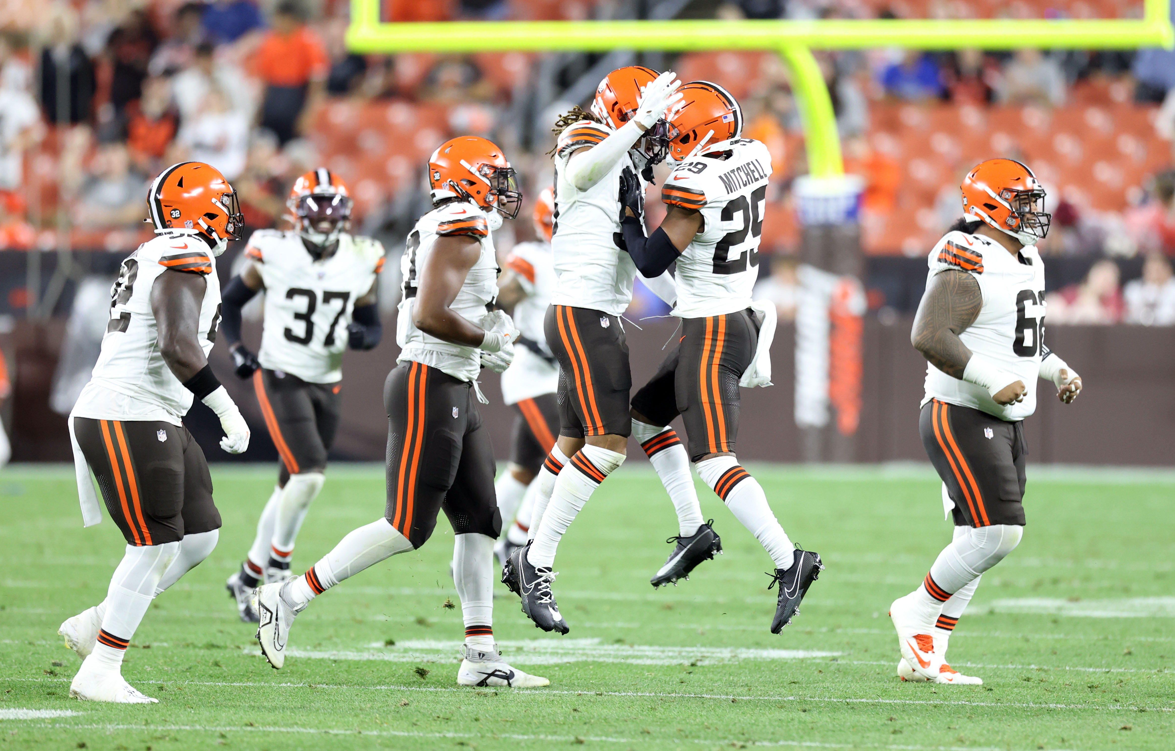 Cleveland Browns safety Ronnie Hickman Jr. intercepts a pass in front of Philadelphia  Eagles tight end Grant Calcaterra (81) during the first half of an NFL  preseason football game Thursday, Aug. 17