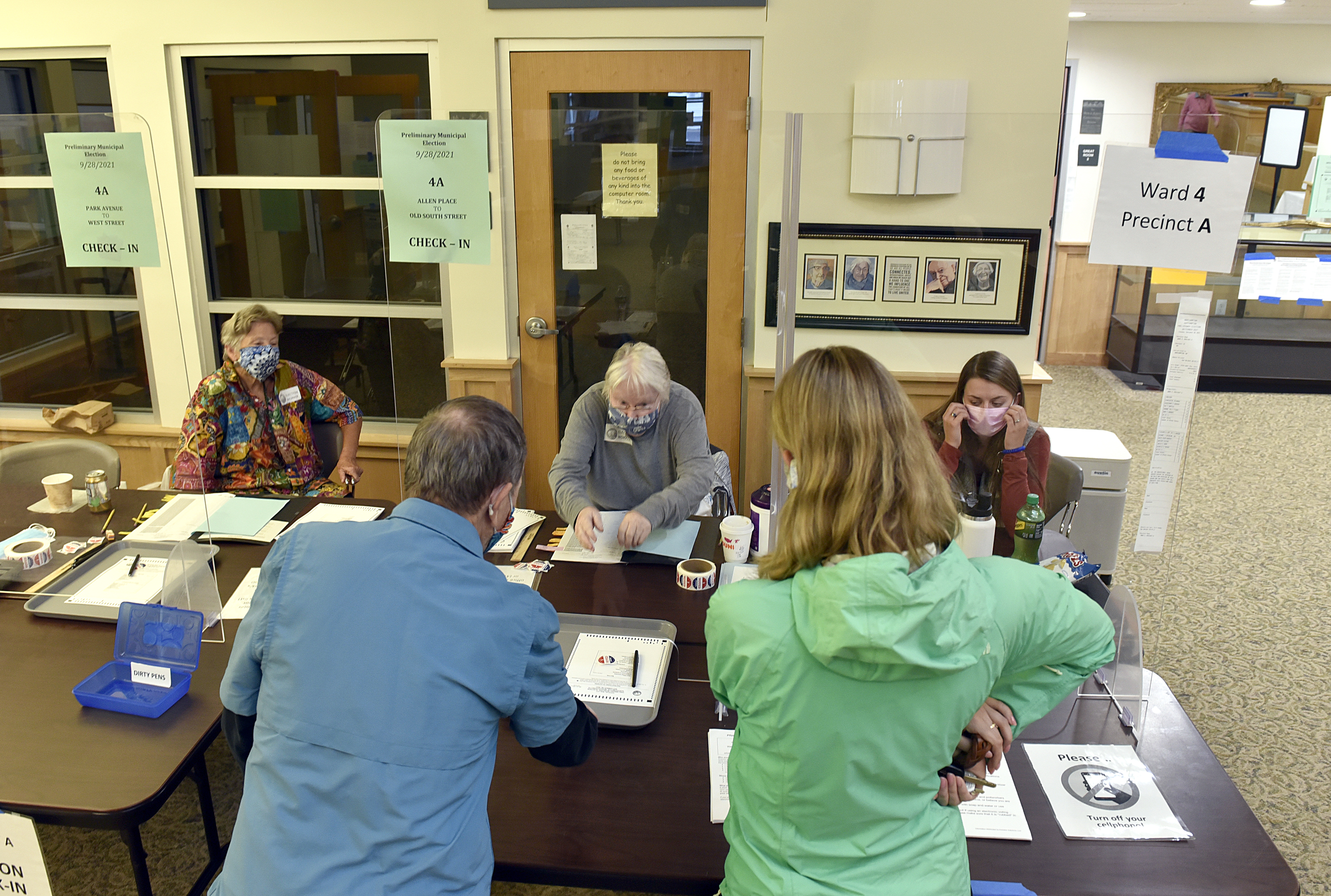 Voters at the senior center check in to cast ballots in the Northampton preliminary election, September 28, 2021.  (Don Treeger / The Republican)