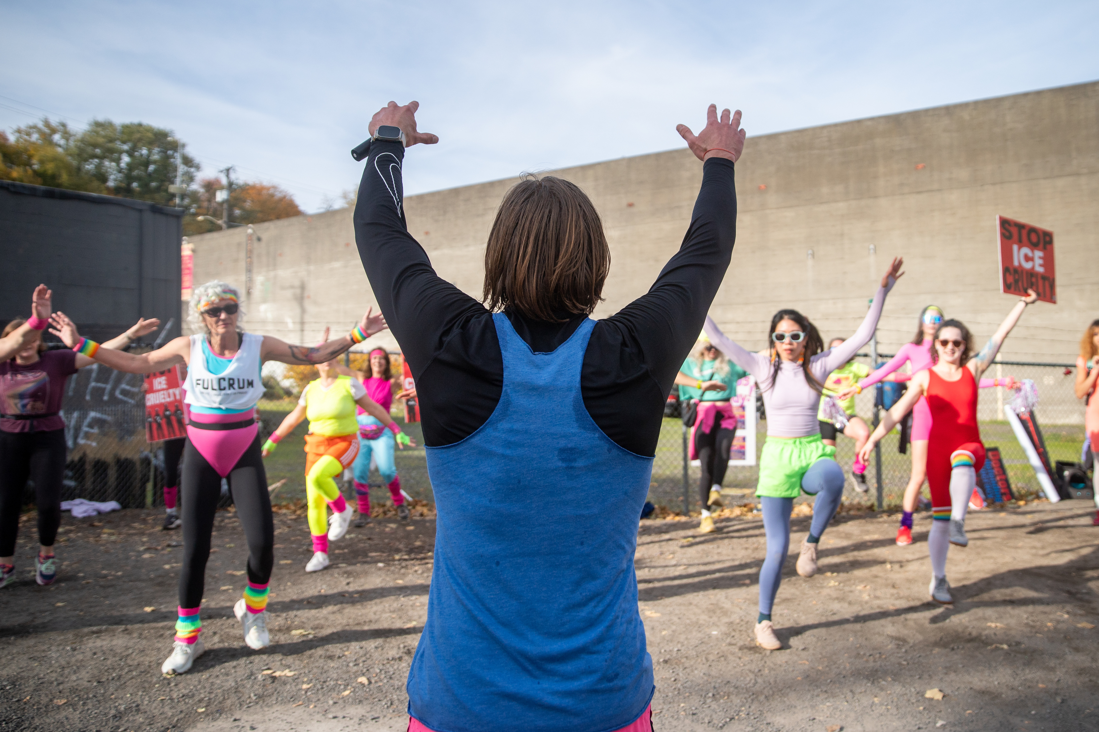 Participants in Fulcrum Fitness’s “Sweatin’ Out the Fascists” held an ’80s-aerobics peaceful protest outside the U.S. Immigration and Customs Enforcement (ICE) facility in South Portland on Sunday, Nov. 9, 2025, collecting donations for the Oregon Food Bank.