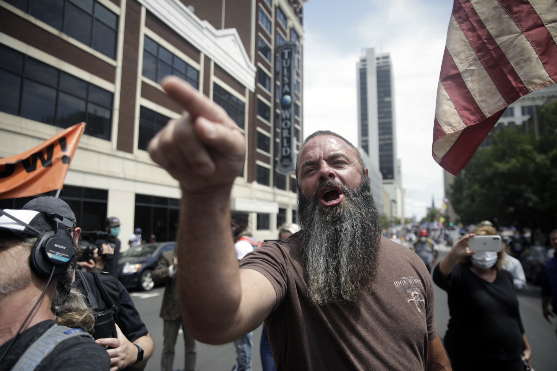 Trump supporters and opponents clash at Fourth and Denver a few blocks away from the BOK Center before President Trump's planned rally, Saturday, June 20, 2020 in Tulsa, Okla. (Mike Simons/Tulsa World via AP)